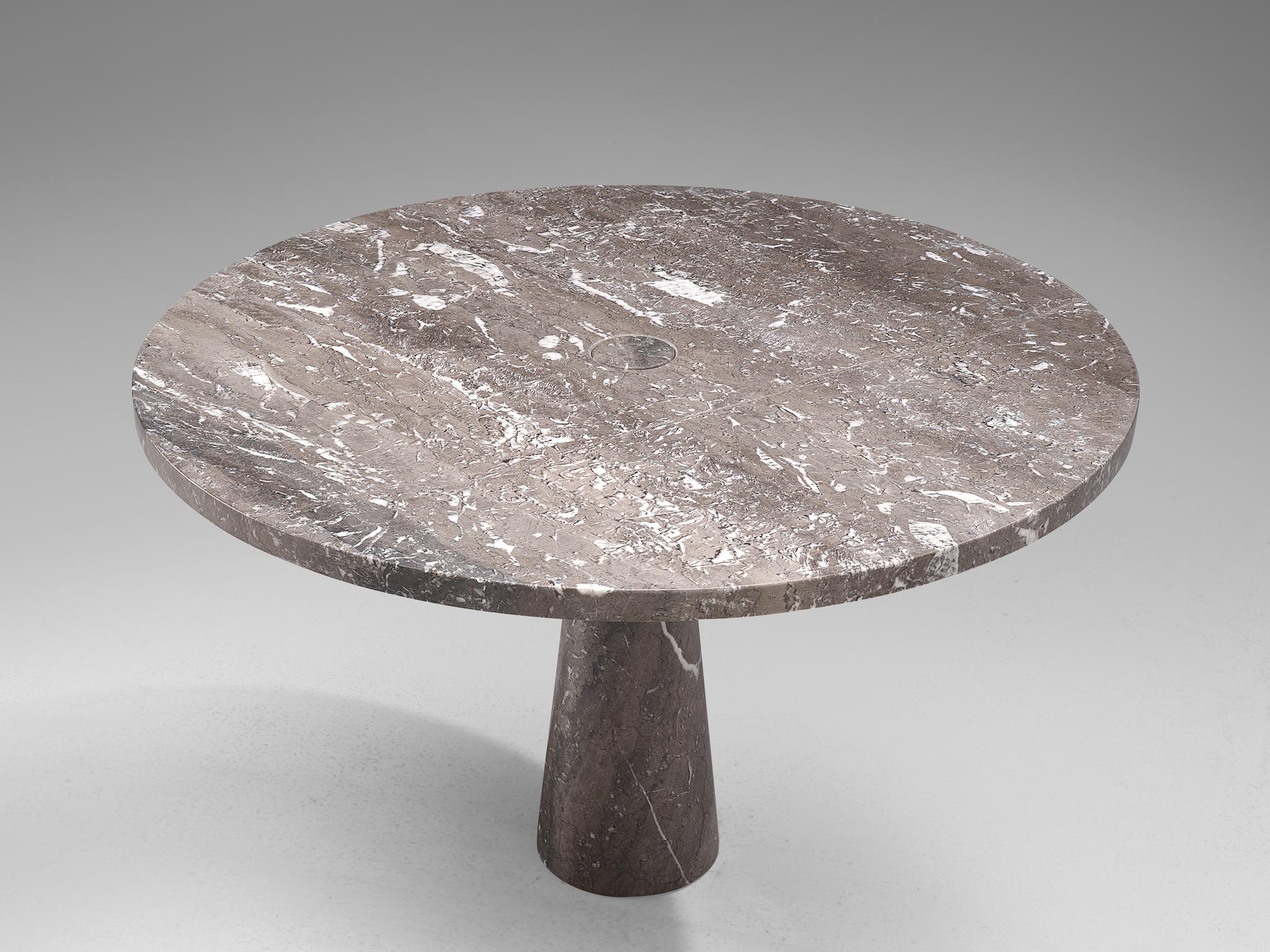 Angelo Mangiarotti, dining table, marble, 1970s.

This sculptural table by Angelo Mangiarotti is a skilful example of postmodern design. The table is executed in grey marble featuring delicate white veins. The soft edged circular table features no