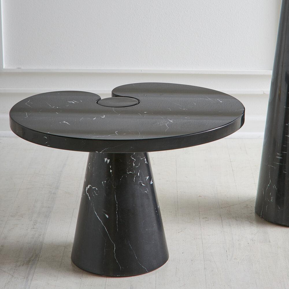 A side table by Italian Architect and designer Angelo Mangiarotti in Nero Marquina marble. A conical base and fitted top feature a polished finish. 

Dimensions: 15.5