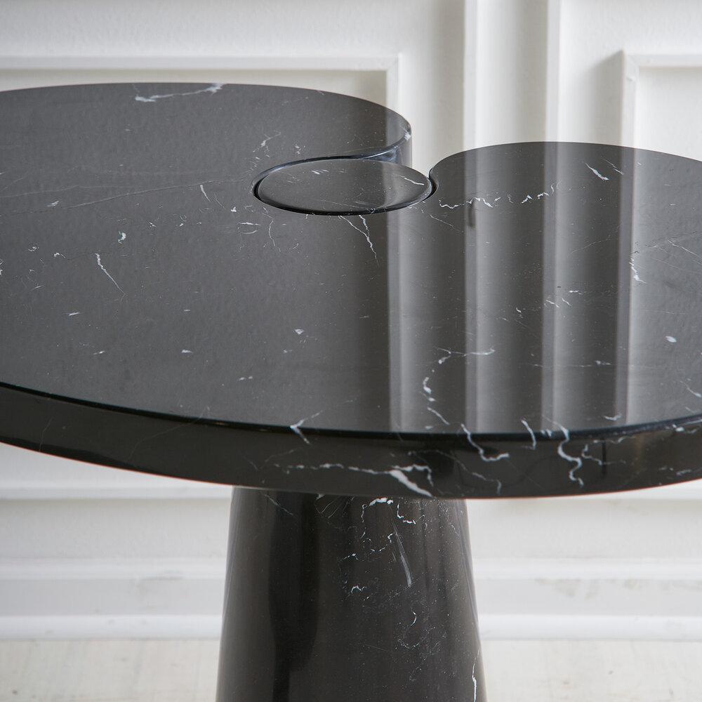 A side table by Italian Architect and designer Angelo Mangiarotti in Nero Marquina Marble. A conical base and fitted top feature a polished finish.