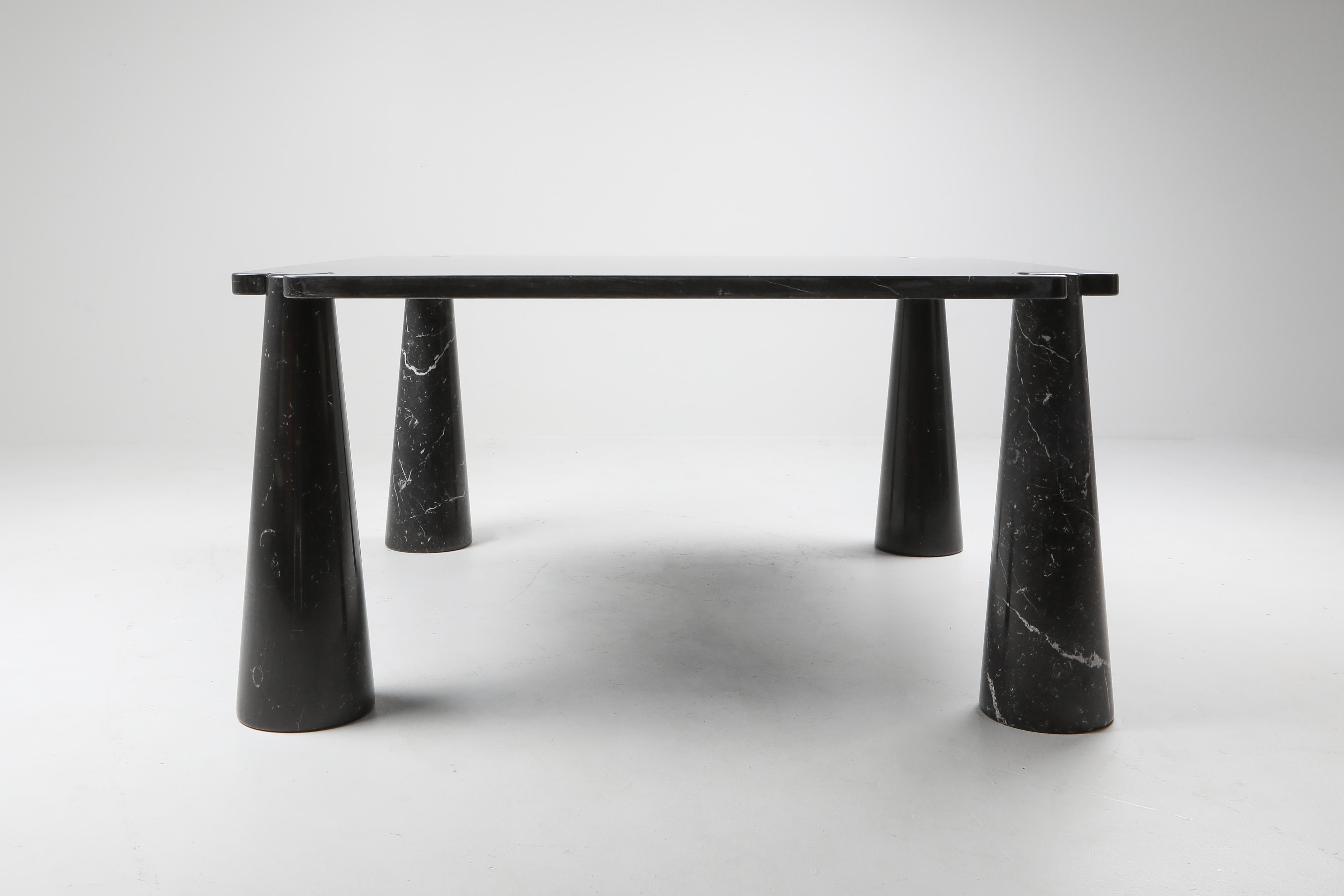 Angelo Mangiarotti, dining table, black marble, 1970s. 

Rare square version of the dining table produced by Skipper.

This sculptural table by Angelo Mangiarotti is a skilful example of Postmodern design.
The table is executed in black marble.