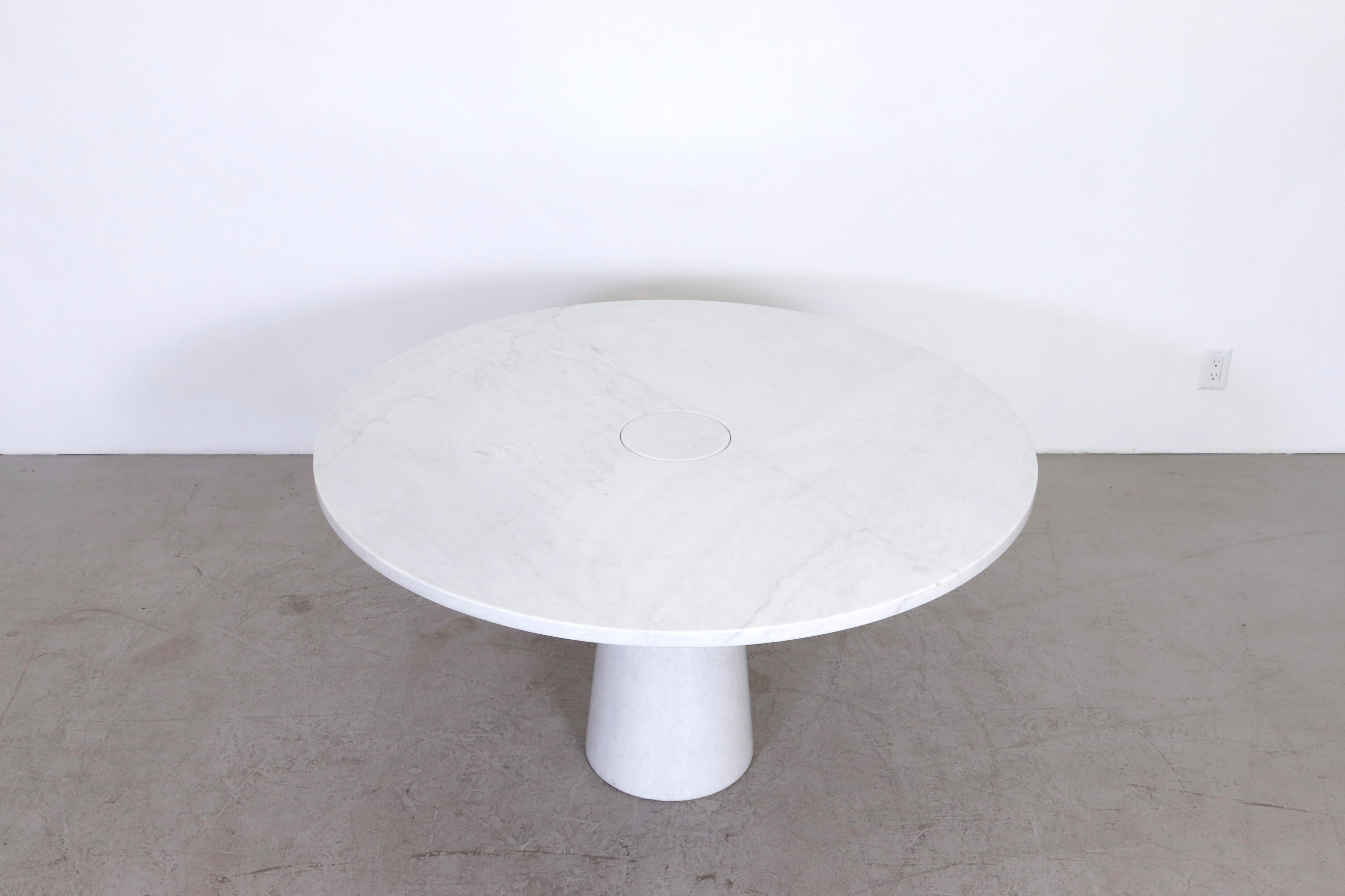 Angelo Mangiarotti Eros table, Carrara marble, Italy circa 1970. Beautifully designed gravity-based dining table using its own weight for stability. In original condition with wear consistent with age and use.