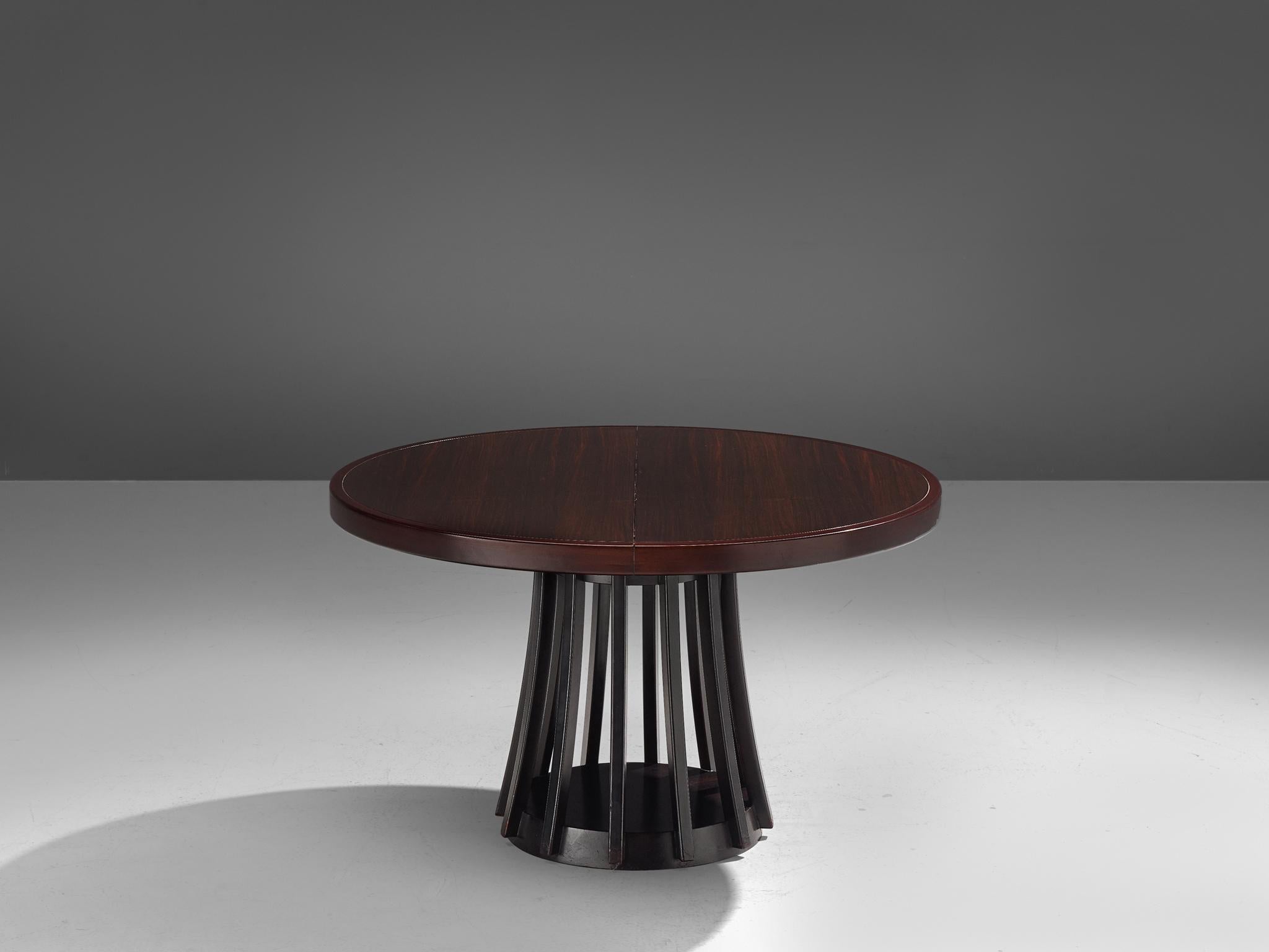 Angelo Mangiarotti for La Sorgente dei Mobili, dining table, mahogany, Italy, 1972.

An extendable mahogany center or dining table by Angelo Mangiarotti, manufactured by La Sorgente Dei Mobili. The pedestal base consists of a round foot, connected