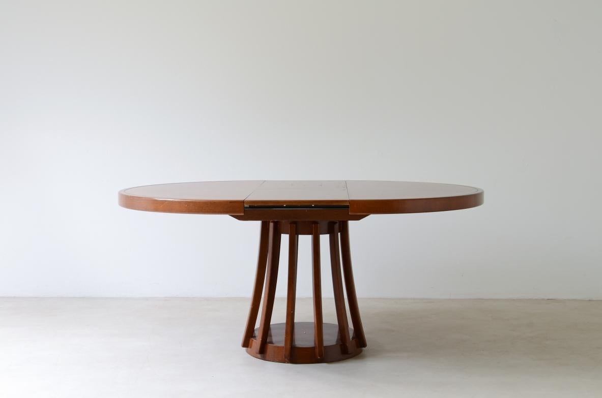 COD-2640
Angelo Mangiarotti (1921-2012)

Extendable walnut table, designed by the architect in 1972. Round pedestal with open slats.

La Sorgente Furniture production,1972.
