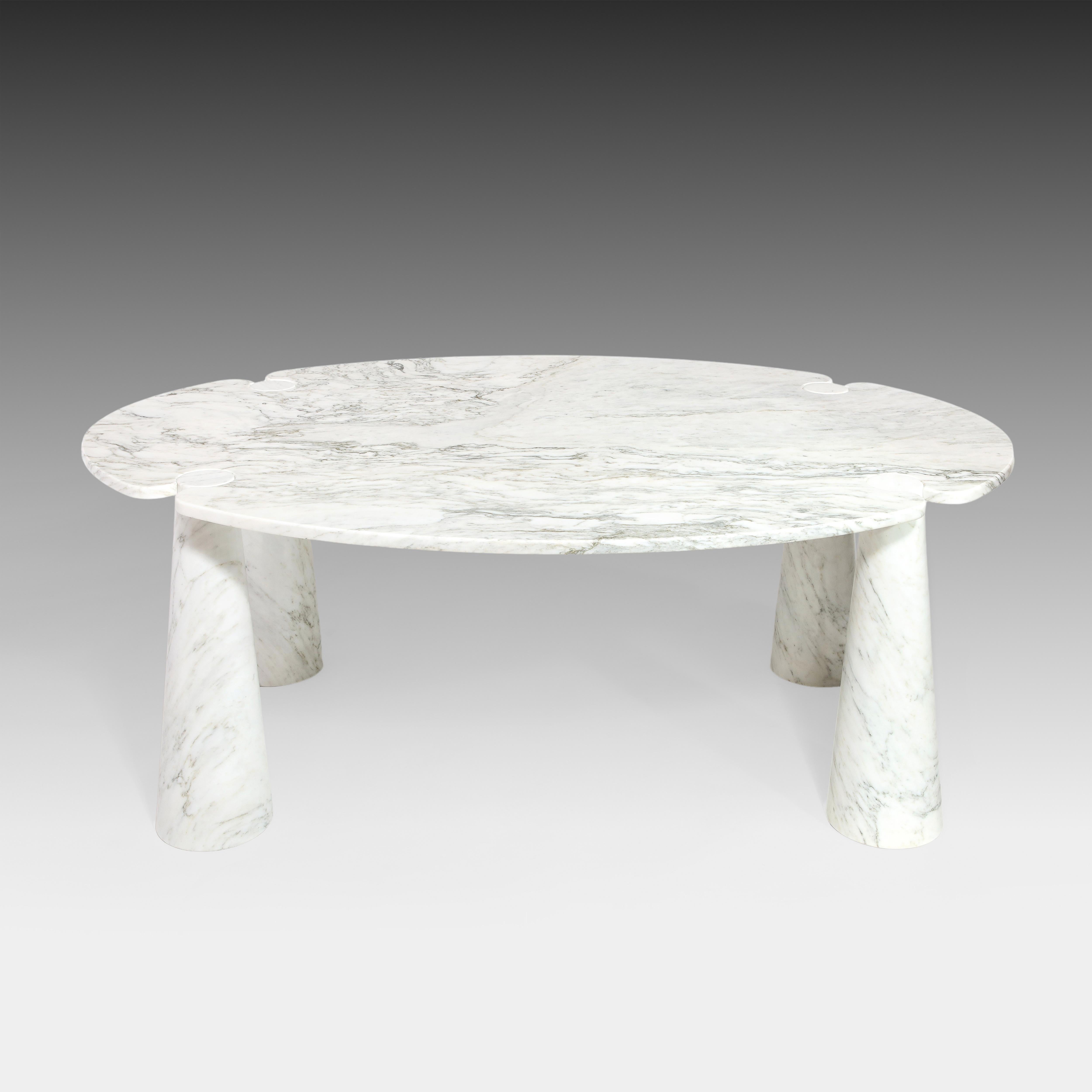 Designed by Angelo Mangiarotti for Skipper from the Eros series, iconic sculptural Carrara marble dining table with large oval top fitted on four conical bases. This elegantly organic dining table has beautiful stark veining throughout. Original