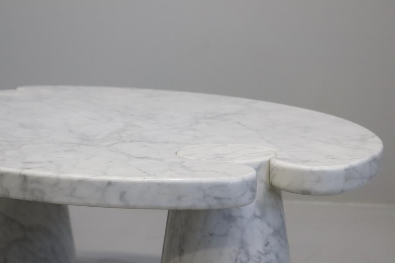 Designed by Angelo Mangiarotti for Skipper from the 'Eros' series, Carrara marble side table with top fitted on conical bases, Italy, 1971. Original Skipper label.
   
