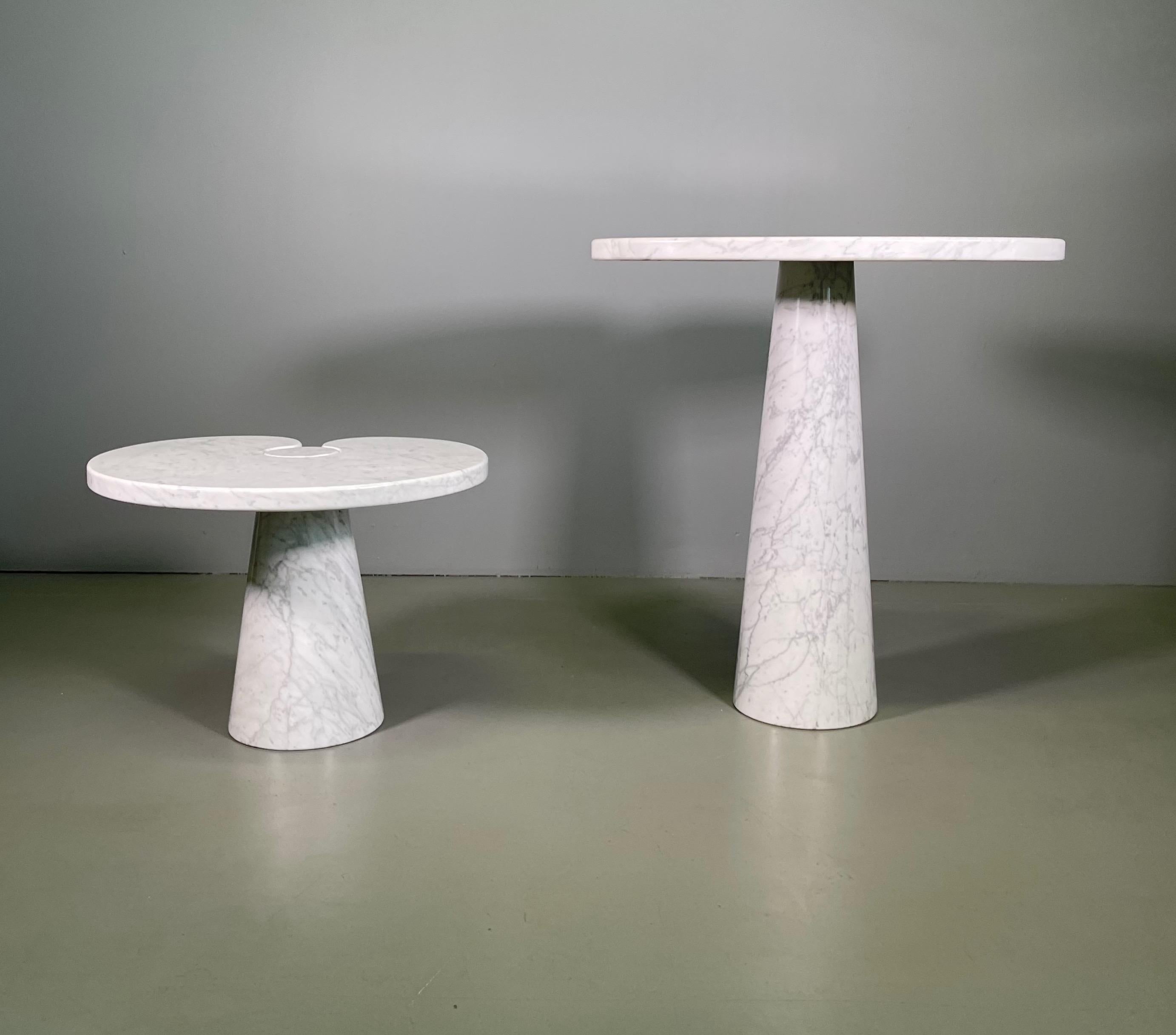Designed by Angelo Mangiarotti for Skipper from the 'Eros' series, Carrara marble side table with top fitted on conical bases, Italy, 1971. Original Skipper label.
Measures: The big H 72 cm x W 66 cm x D 45 cm
The little H 40 cm x W 55 cm x D 46