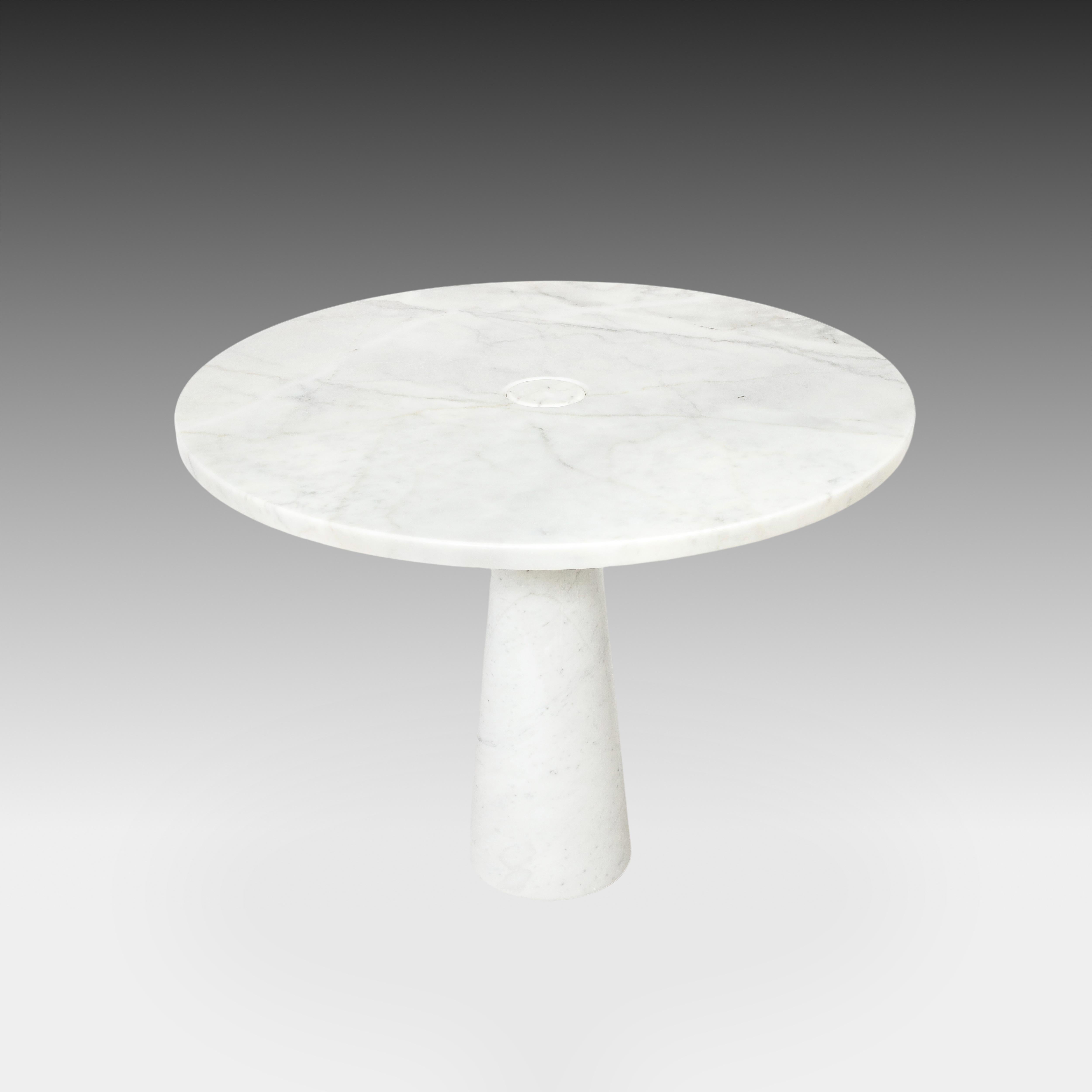 Designed by Angelo Mangiarotti for Skipper from the 'Eros' series, Carrara marble round dining or center table with top fitted on a conical base. This elegant organic table has beautiful subtle veining throughout the Carrara marble. Original Skipper