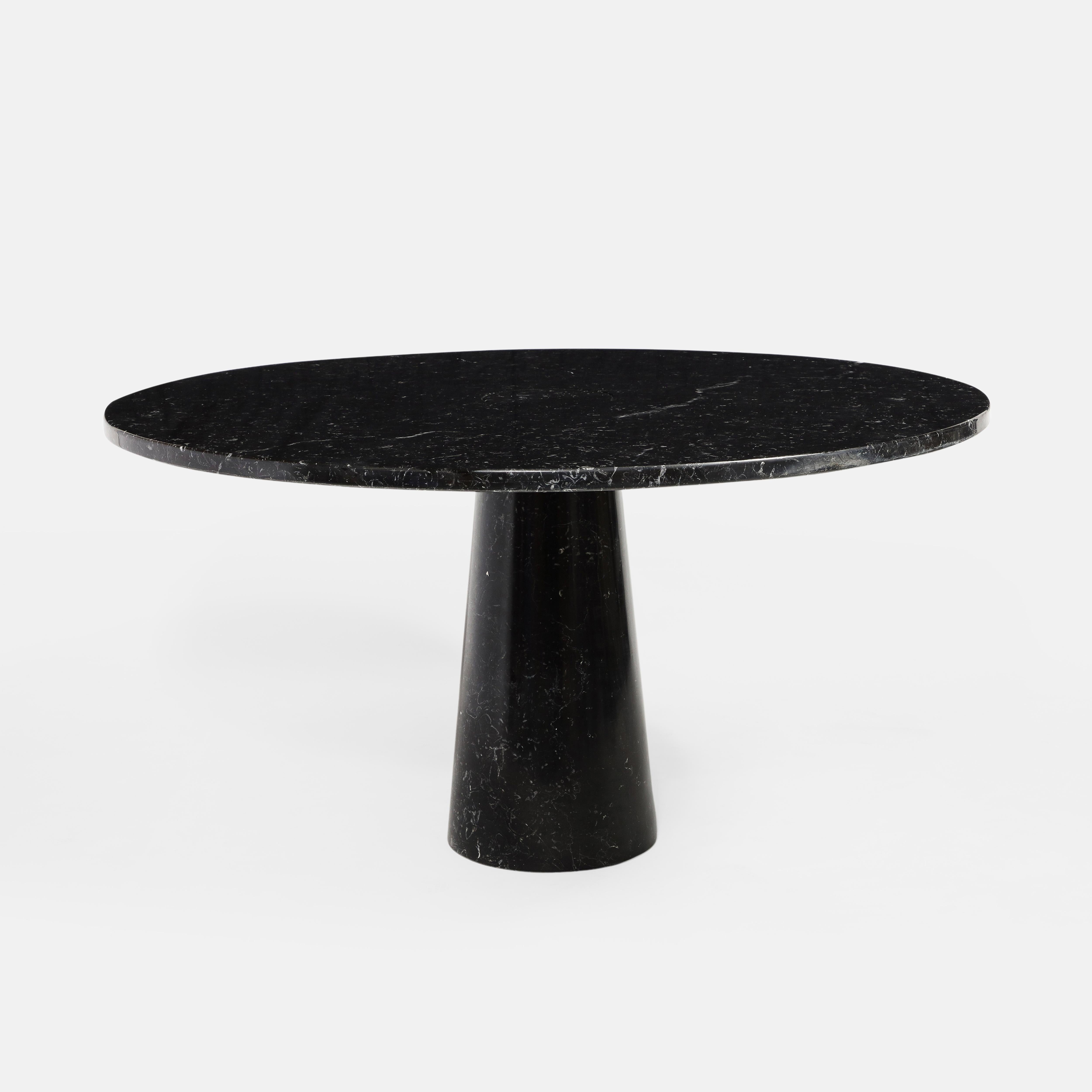 Designed by Angelo Mangiarotti for Skipper from the 'Eros' series, Nero Marquina marble round dining or center table with top fitted on a conical base. This elegant organic table has beautiful subtle veining throughout the black Marquina marble.