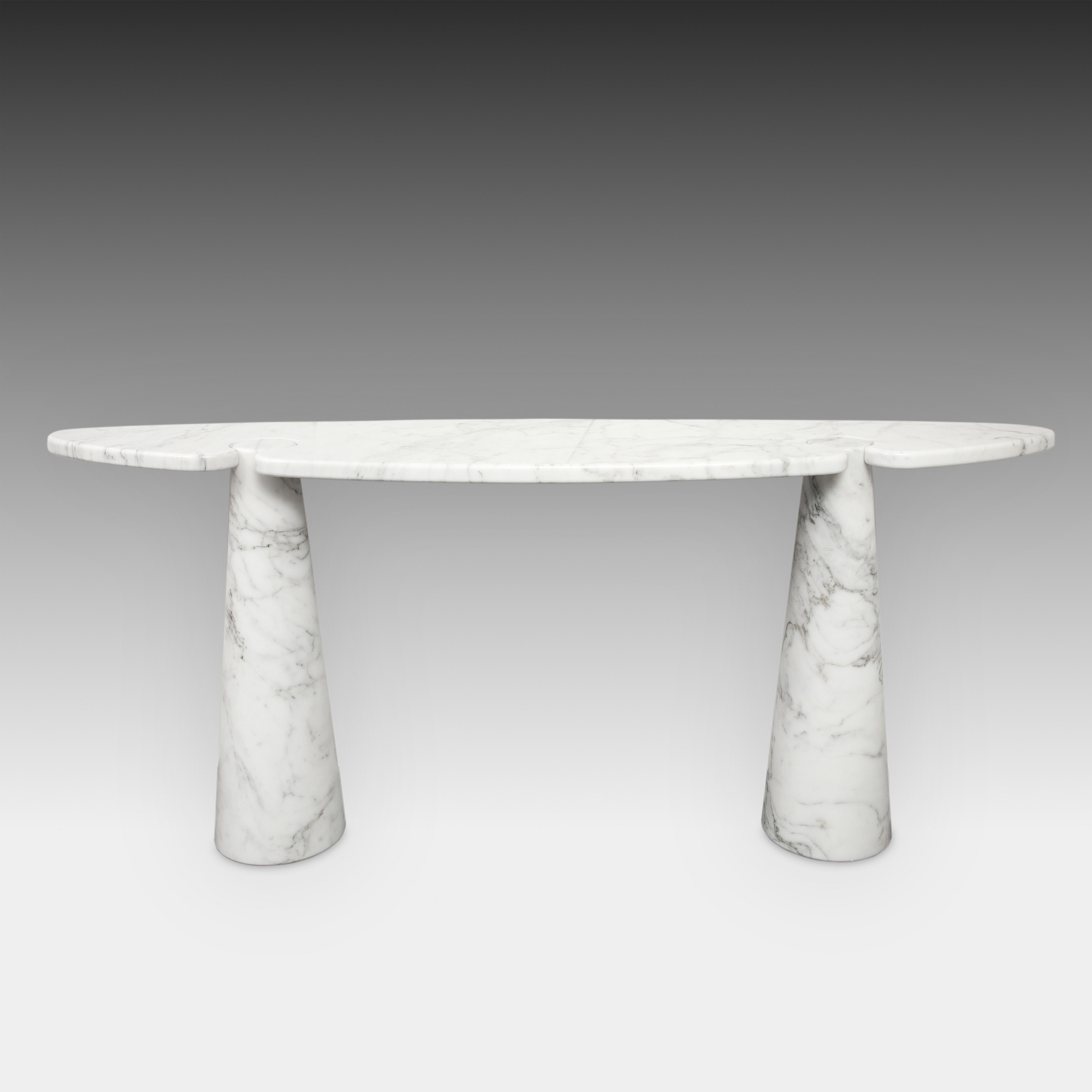 Designed by Angelo Mangiarotti for Skipper from the Eros series, iconic pair of Carrara marble console tables each with large elliptical top fitted on two conical bases. These elegantly organic console tables have beautiful subtle veining