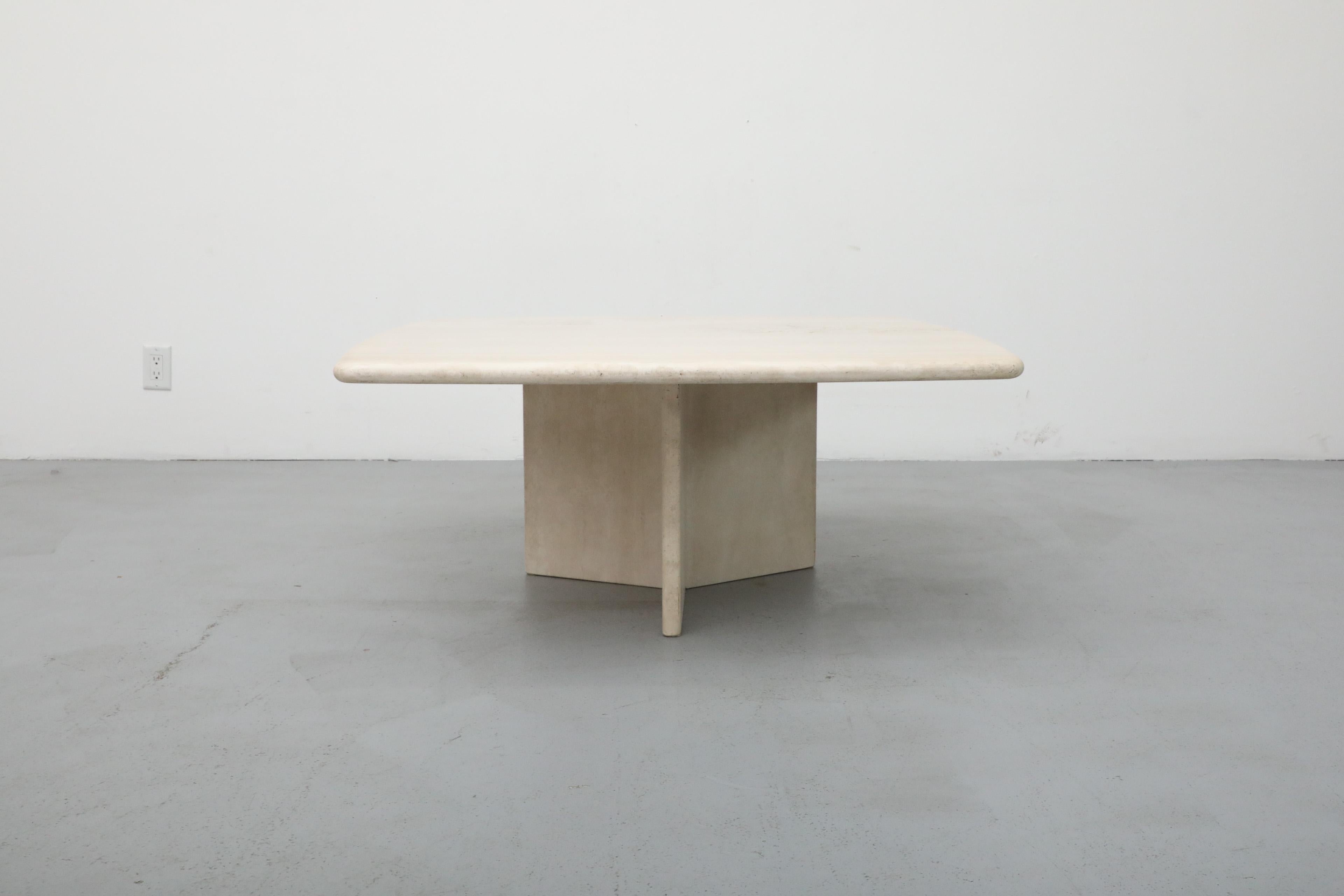 This coffee table is a striking example of Mid-Century modern design. It's form is inspired by the work of Angelo Mangiarotti, an Italian architect and designer who is known for his innovative use of materials and sculptural forms. The table has a