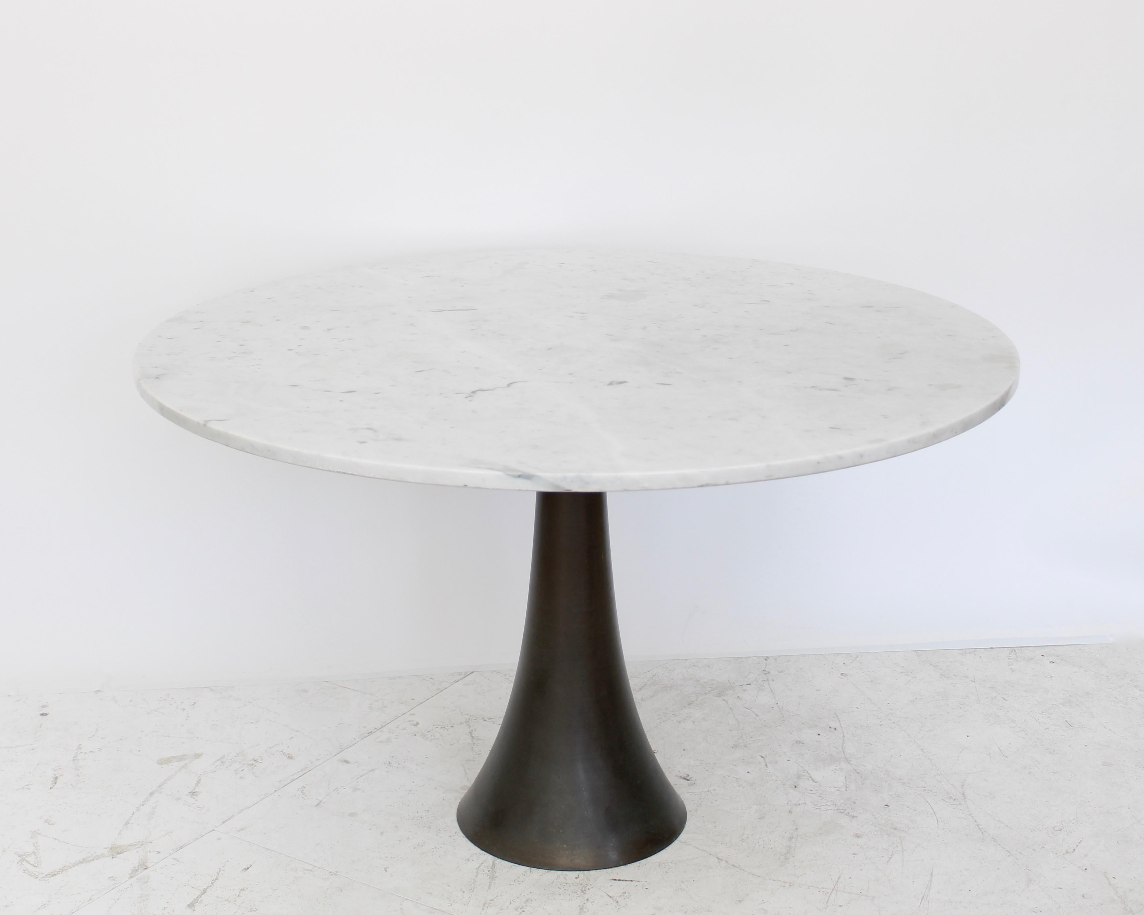 Angelo Mangiarotti dining table, Model 302 Manufactured by Bernini.
Turned tulip shaped cast bronze base and Carrara marble top. 
Bronze base by Fonderia Battaglia. 
Made in Italy, circa 1959.An Italian 20th Century design Icon.
The bronze base