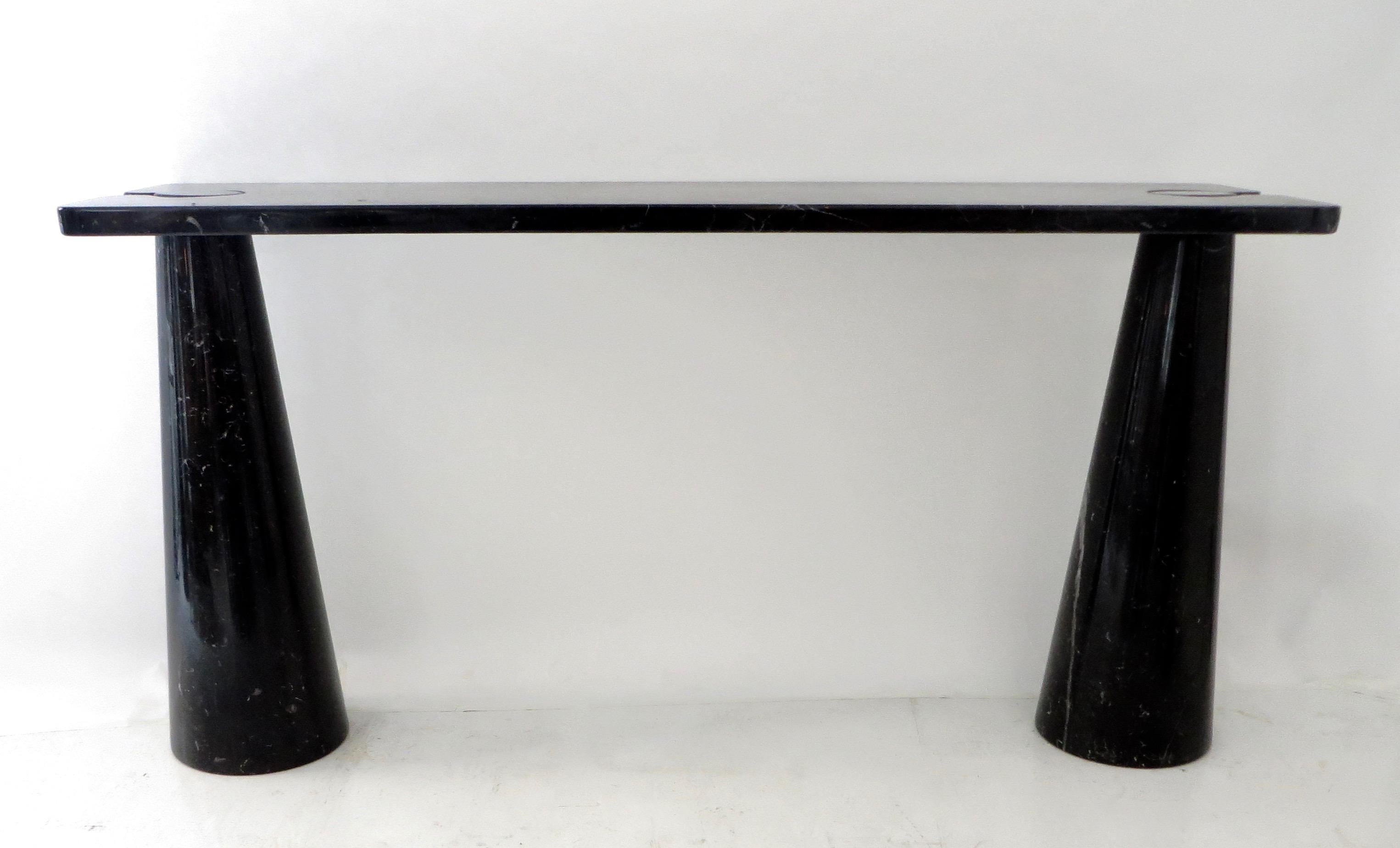 Angelo Mangiarotti vintage iconic Italian console Eros collection for Skipper model E 20.
The black or Nero Marquina marble is veined nicely.
The top sits on the conical legs in the iconic Mangiarotti finely designed architectural manner. No