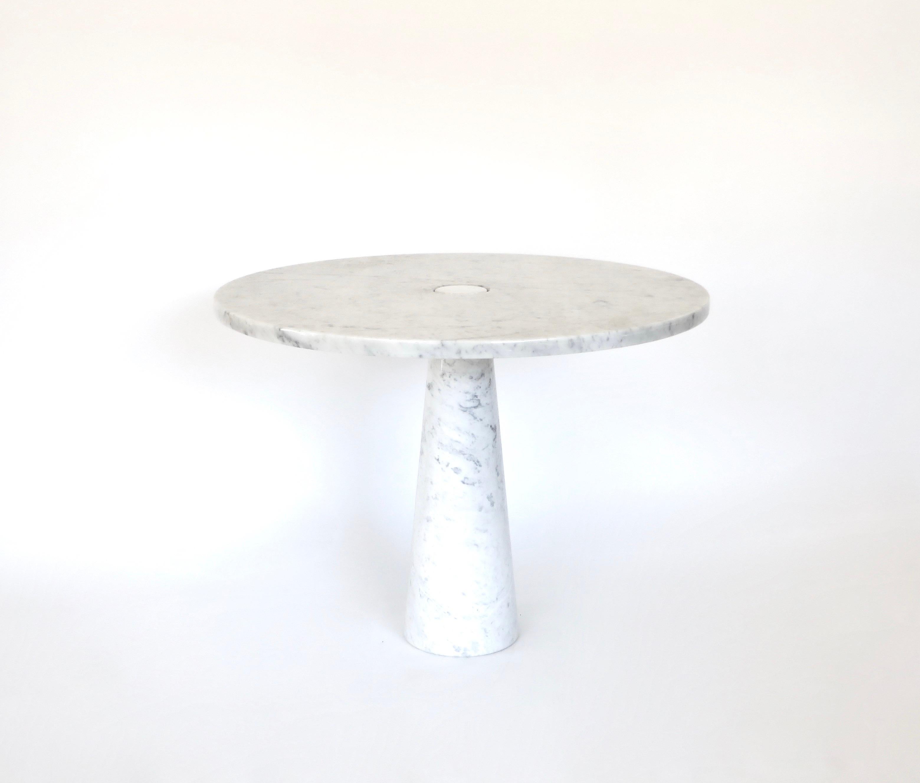 Angelo Mangiarotti vintage Eros Carrara marble dining or center table. 
This example has the iconic grey veining of Carrara marble.
The structural design of the “Eros” tables involves gravity-based embedding between the top and leg made possible