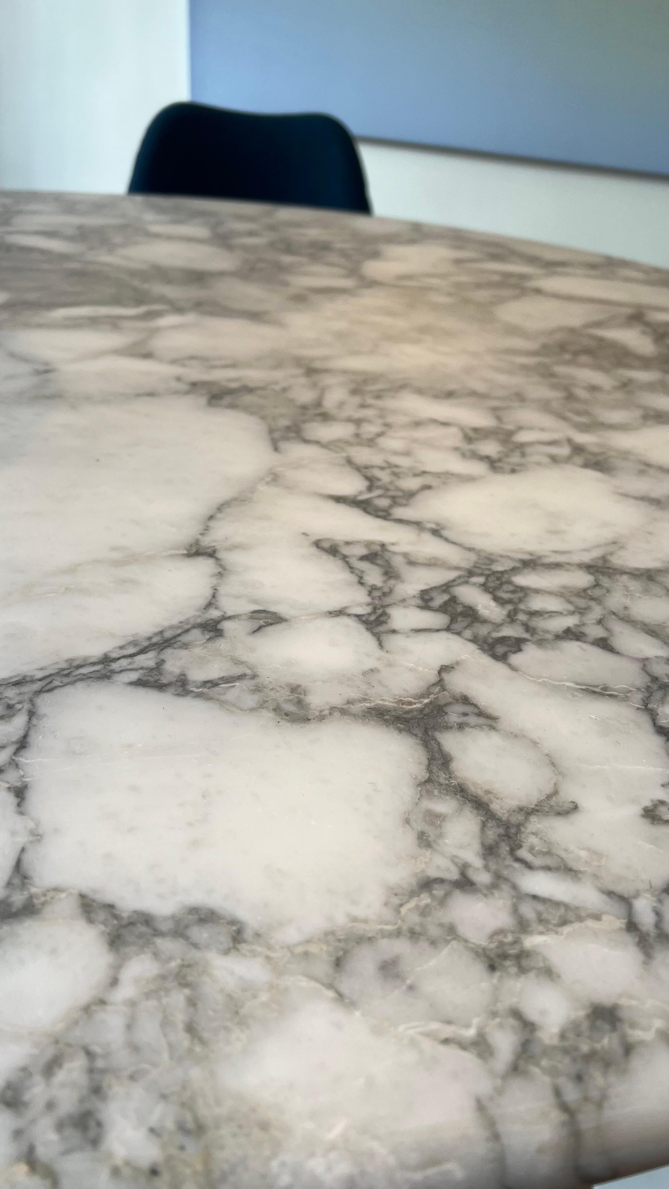 Stunning marble M1 dining table designed by Angelo Mangiarotti and manufactured by Skipper, Italy 1969. This is for a solid white carrara marble dining table. The round top rests perfectly on the cone shaped base. This architectural table was based