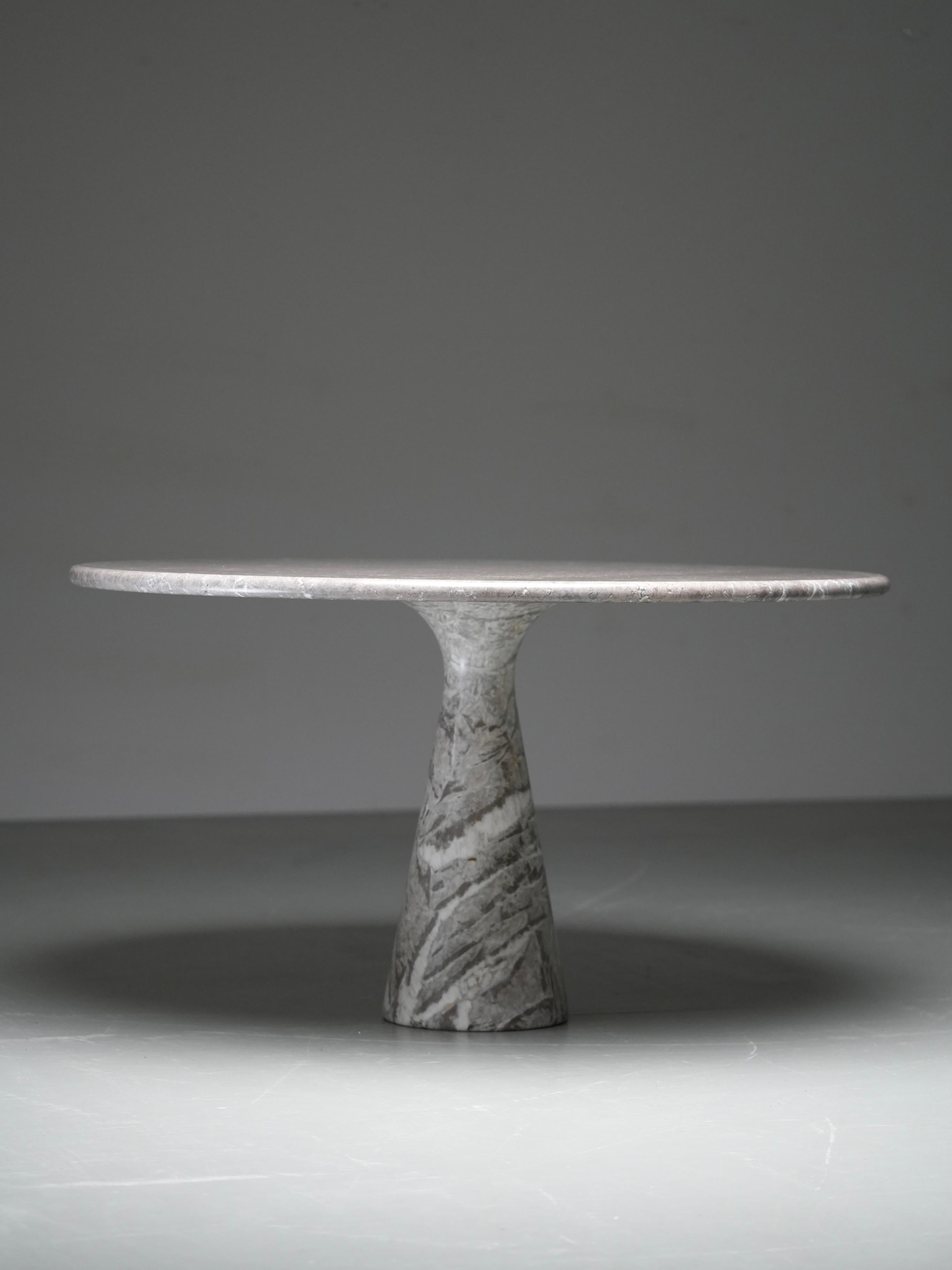 This round marble dining table is the M1 model by Angelo Mangiarotti, produced by Skipper in Italy during the 1970s. It is one of Mangiarotti’s most celebrated designs, showing his mastery of gravity-based construction and his fascination with