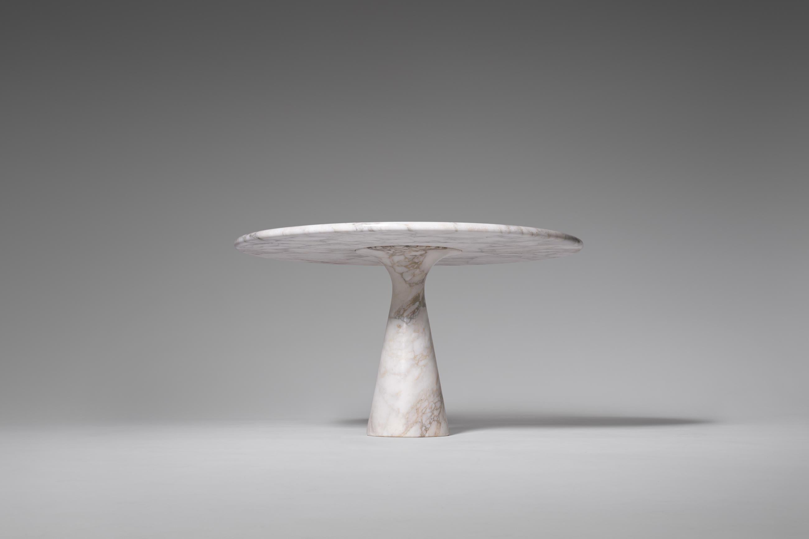 Beautiful pedestal dining table model ‘M1’ by Angelo Mangiarotti for Skipper, Italy, 1969. Exceptional multi colored Calacatta marble version with a stunning pattern. The 3 cm thick marble top lays on a solid marble cone shaped base, all in perfect
