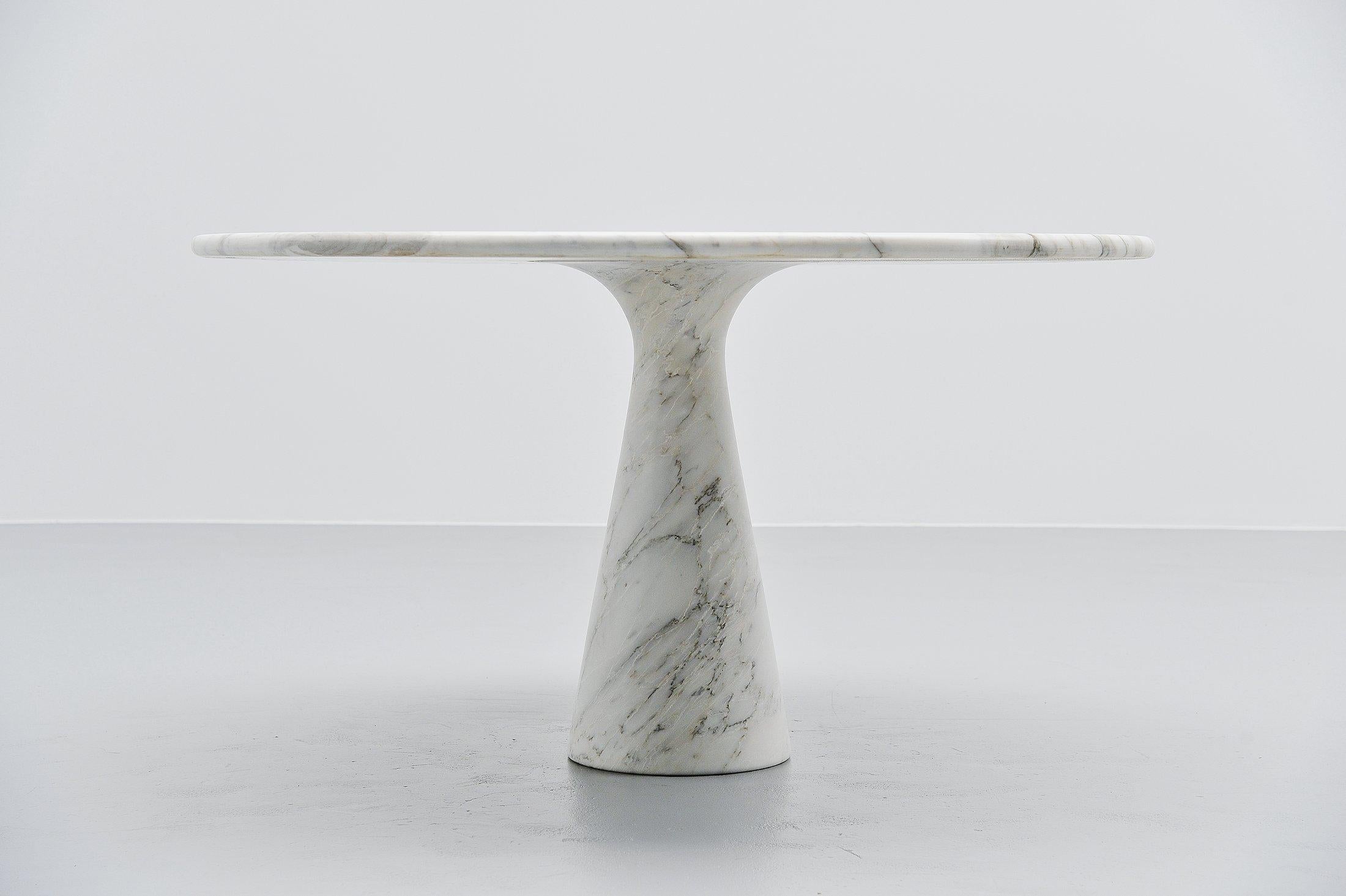 Stunning marble M1 dining table designed by Angelo Mangiarotti and manufactured by Skipper, Italy 1969. This is for a solid white Carrara marble dining table. The round top rests perfectly on the cone shaped base. This architectural table was based