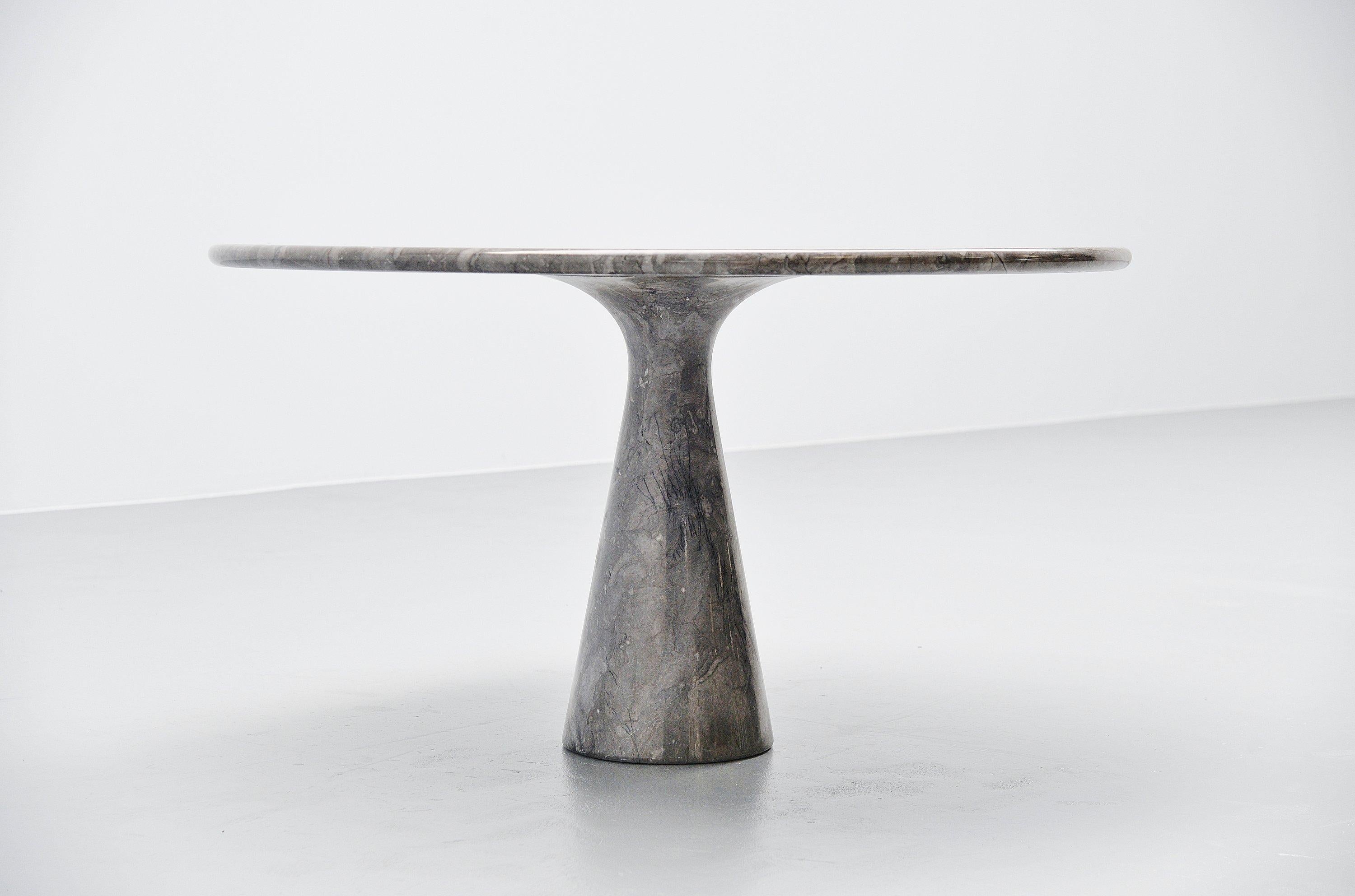 Fantastic unique marble M1T70 dining table designed by Angelo Mangiarotti and manufactured by Skipper, Italy, 1969. This is for a solid and beautiful grey marble dining table. The light grey marble has nice white veins to it and there are some kind