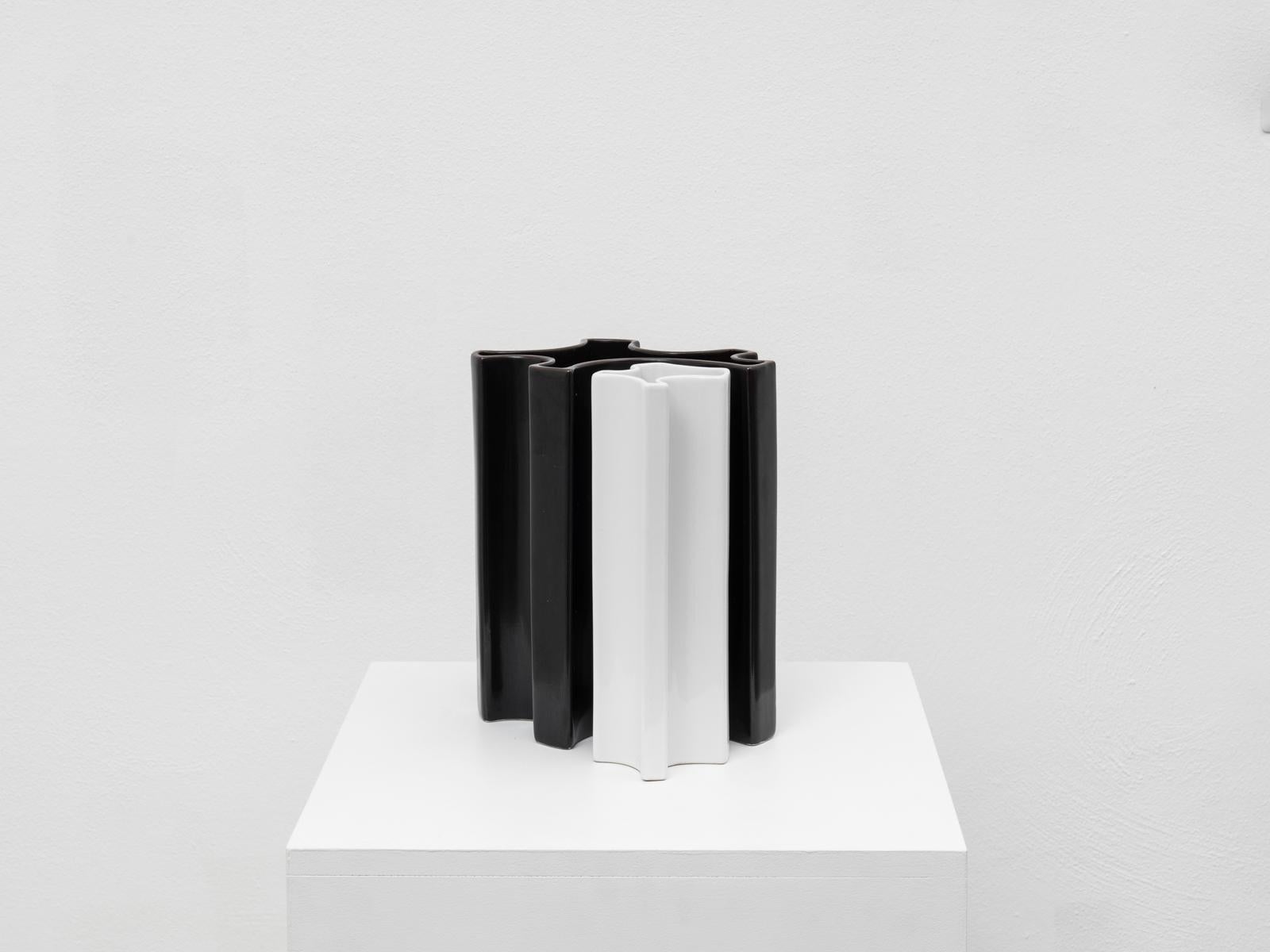 This iconic midcentury ceramic vases are part of the series of vessels designed by Italian architect Angelo Mangiarotti for Fratelli Brambilla in the 1960s.
This vases are model M6 and M8, designed in 1968. M6 has a clear white color, while M8 is