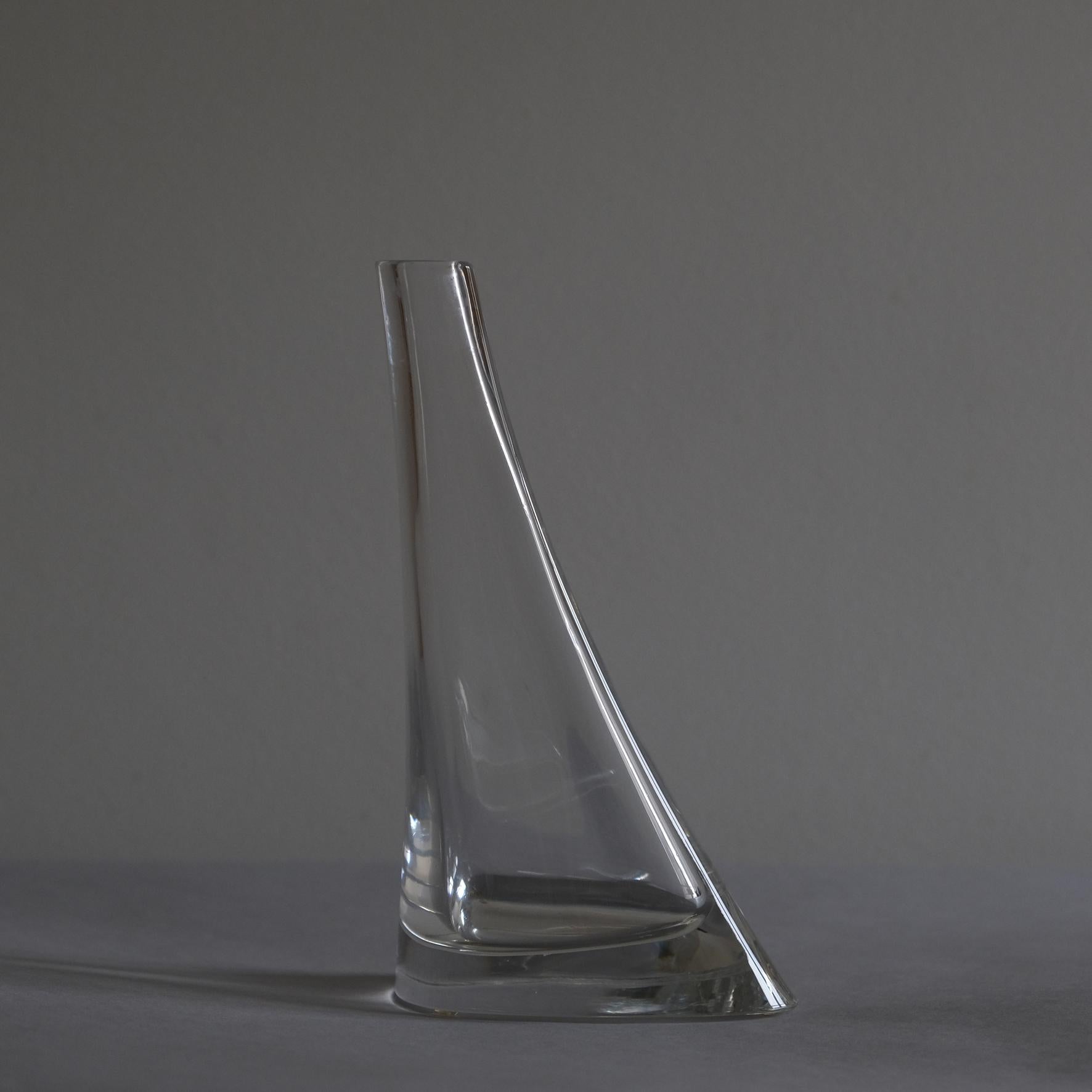 A cristal vase with a triangular elongated body.
Colle.
1970s.

 