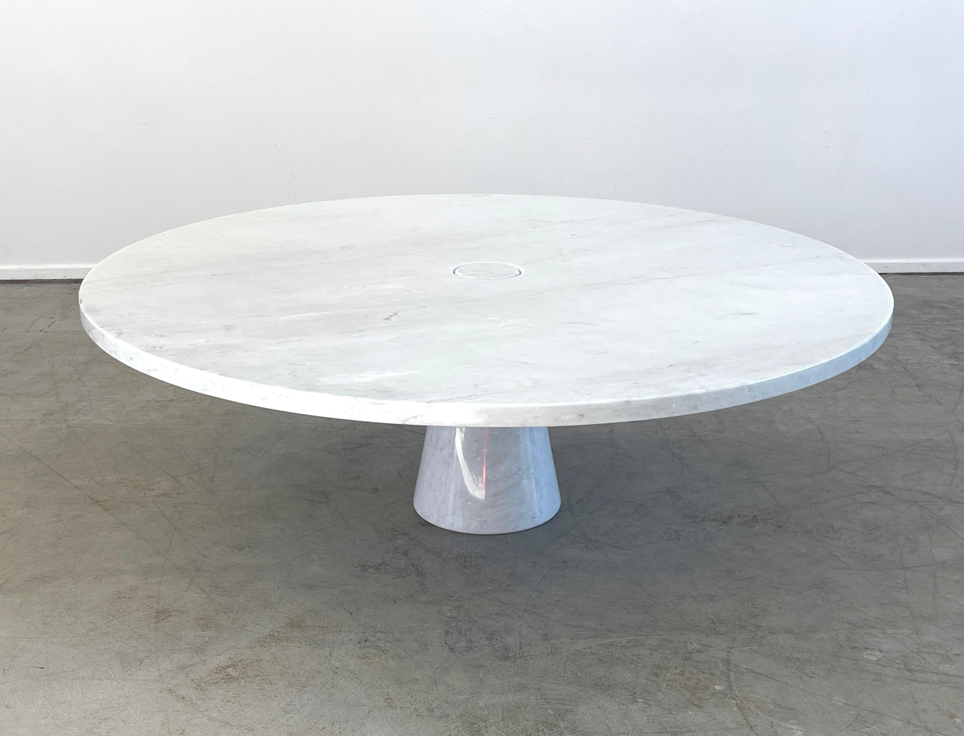 Rare large sized Angelo Mangiarotti designed coffee table as part of the Eros collection for Skipper, 1971 .
Rare round shape with carrara marble with singular pedestal cone base.
 