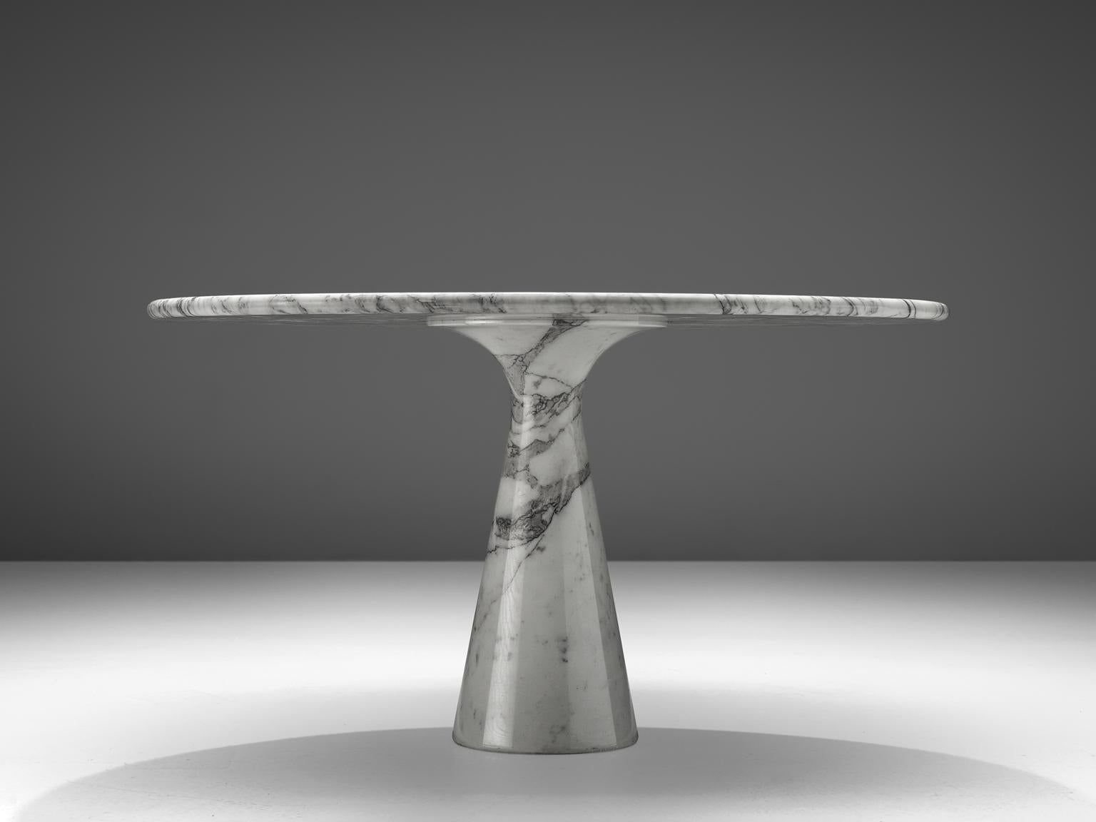 Angelo Mangiarotti, pedestal dining table, marble, Italy, 1970s 

This Carrara marble table is designed by Italian Angelo Mangiarotti. The circular top rests perfectly on the cone. The design showcases a play of balance and rhythm. The design is