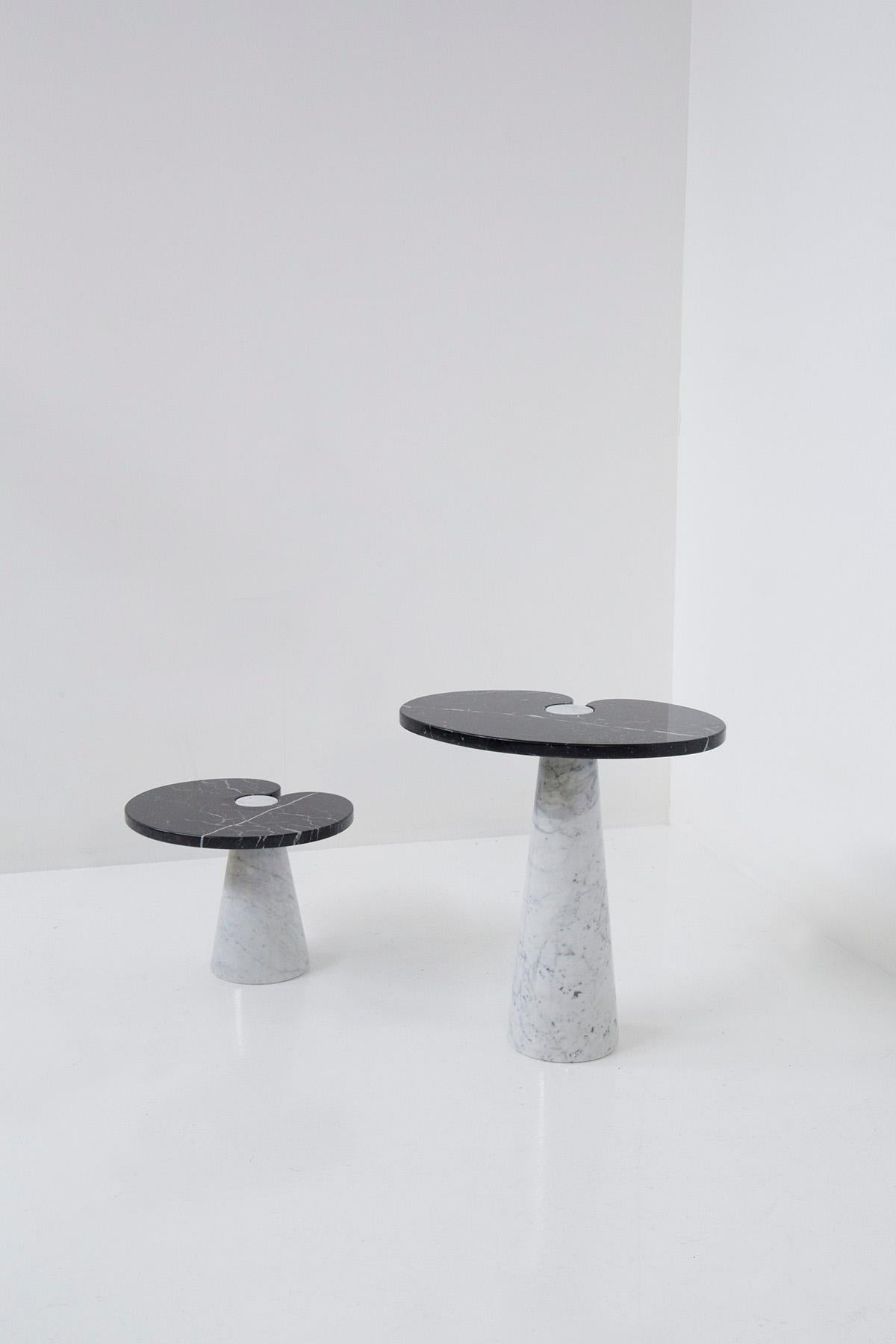 Elegant pair of bi-coloured marble coffee tables designed by Angelo Mangiarotti for the Skipper manufacture. The pair of coffee tables consists of a high and a lower coffee table. Both table tops are made of black marquina marble, while its pedestal