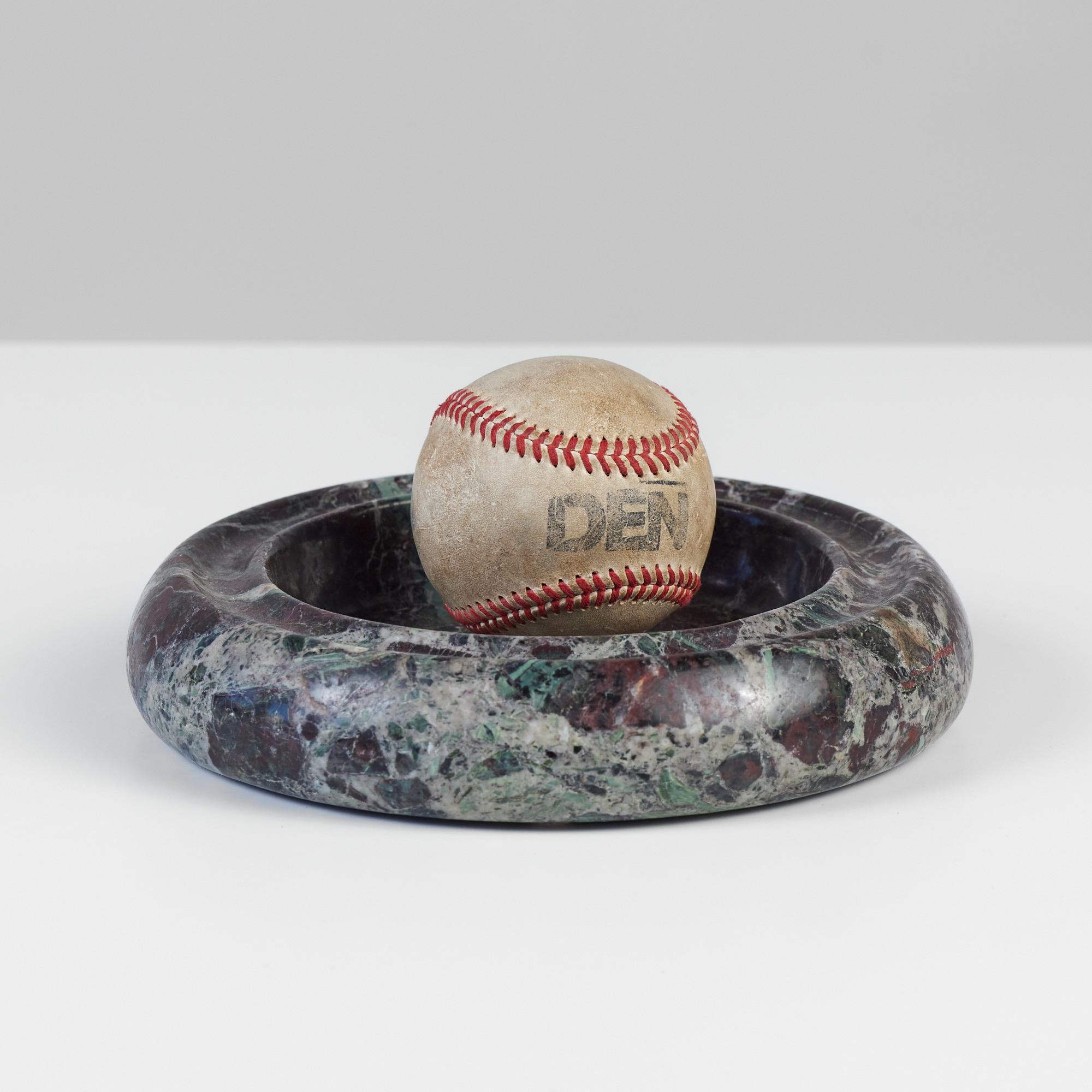 Marble ashtray in the style of Angelo Mangiarotti. The thick rounded ashtray showcases a gorgeous oxblood and jade colored marble with swirls of cream and black. The rim has a slight divot around the top.

Dimensions: 8“ diameter x 1.75”