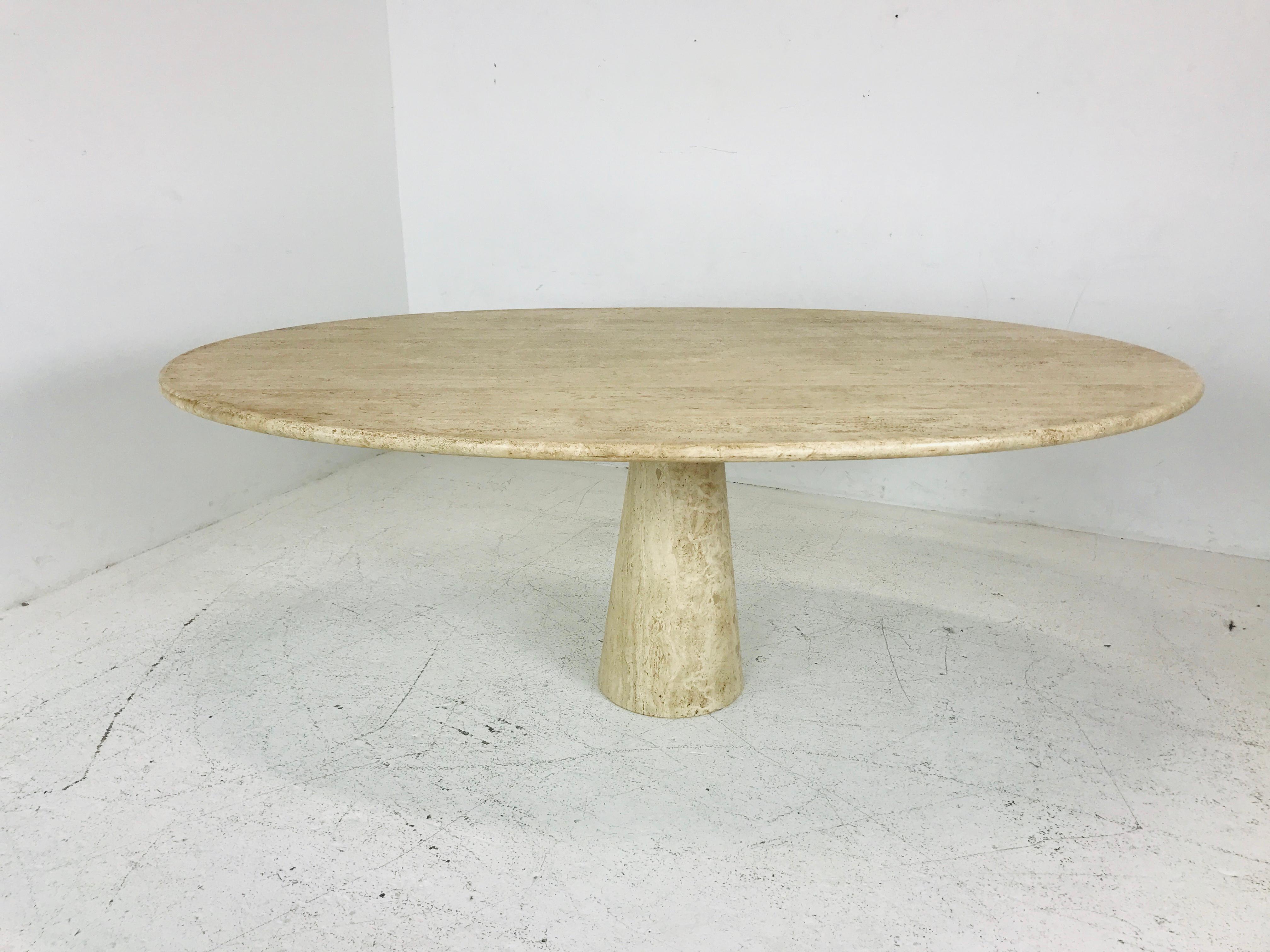 Angelo Mangiarotti style travertine marble oval dining table. Table is in good vintage condition.
The table top removes from the base for more convenient transport--each piece weighing approximately 250 pounds for a total of 500