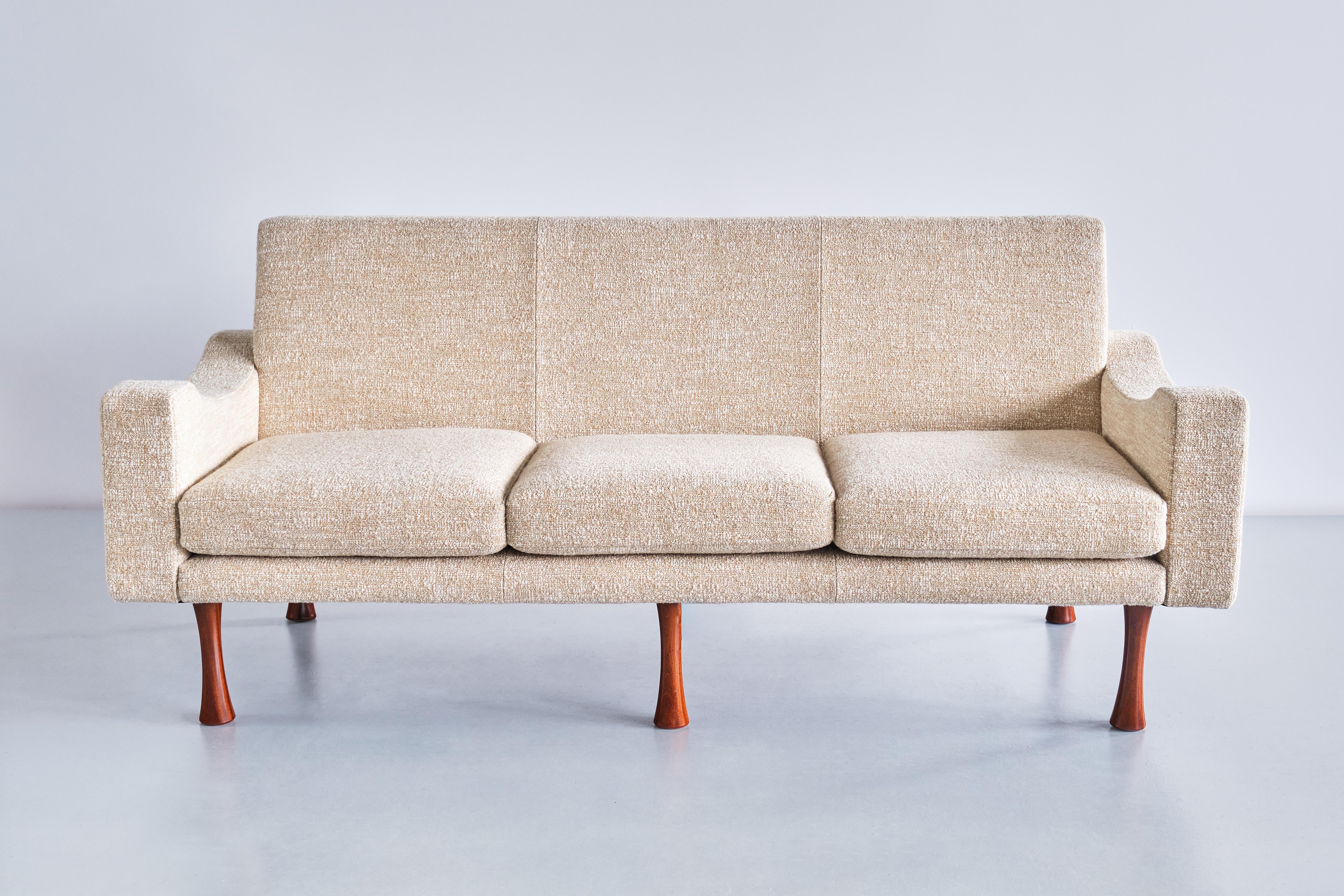 This very rare three seat sofa was designed by Angelo Mangiarotti and produced by the Italian manufacturer La Sorgente dei Mobili in the early 1970s. The design is marked by the geometric shapes of the upholstered frame combined with a curved