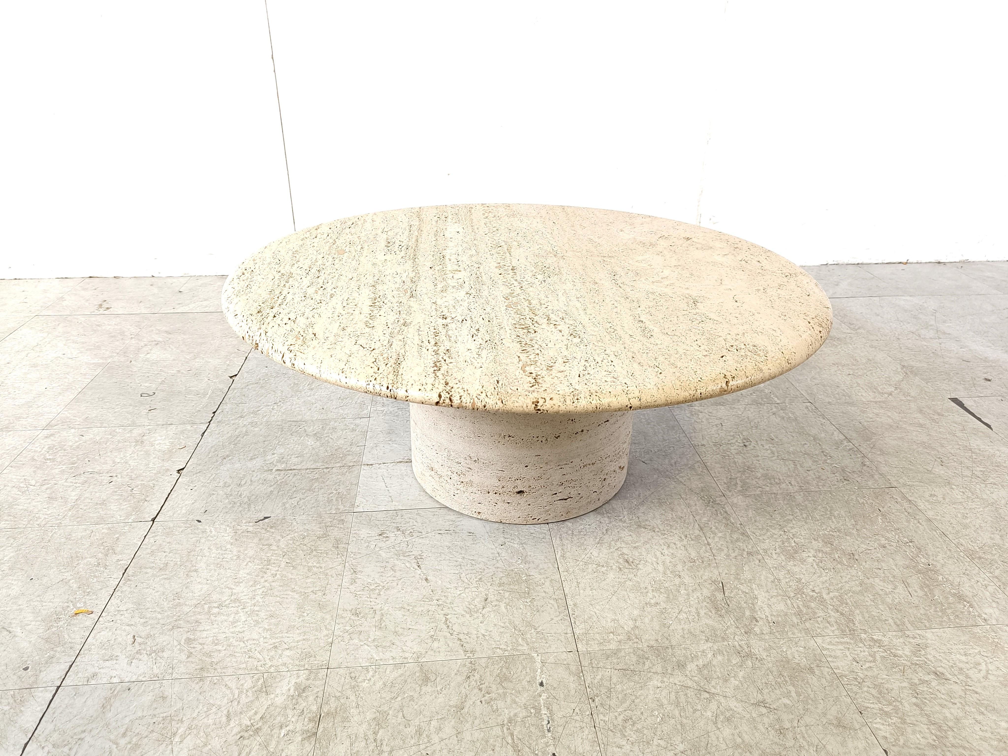 Timeless travertine coffee table with a round and nicely finished top mounted on a round cyllindrical base.

Gorgeous natural travertine stone.

Good condition

1970s - Italy

Height: 37cm
Diameter: 90cm

Ref.: 203066