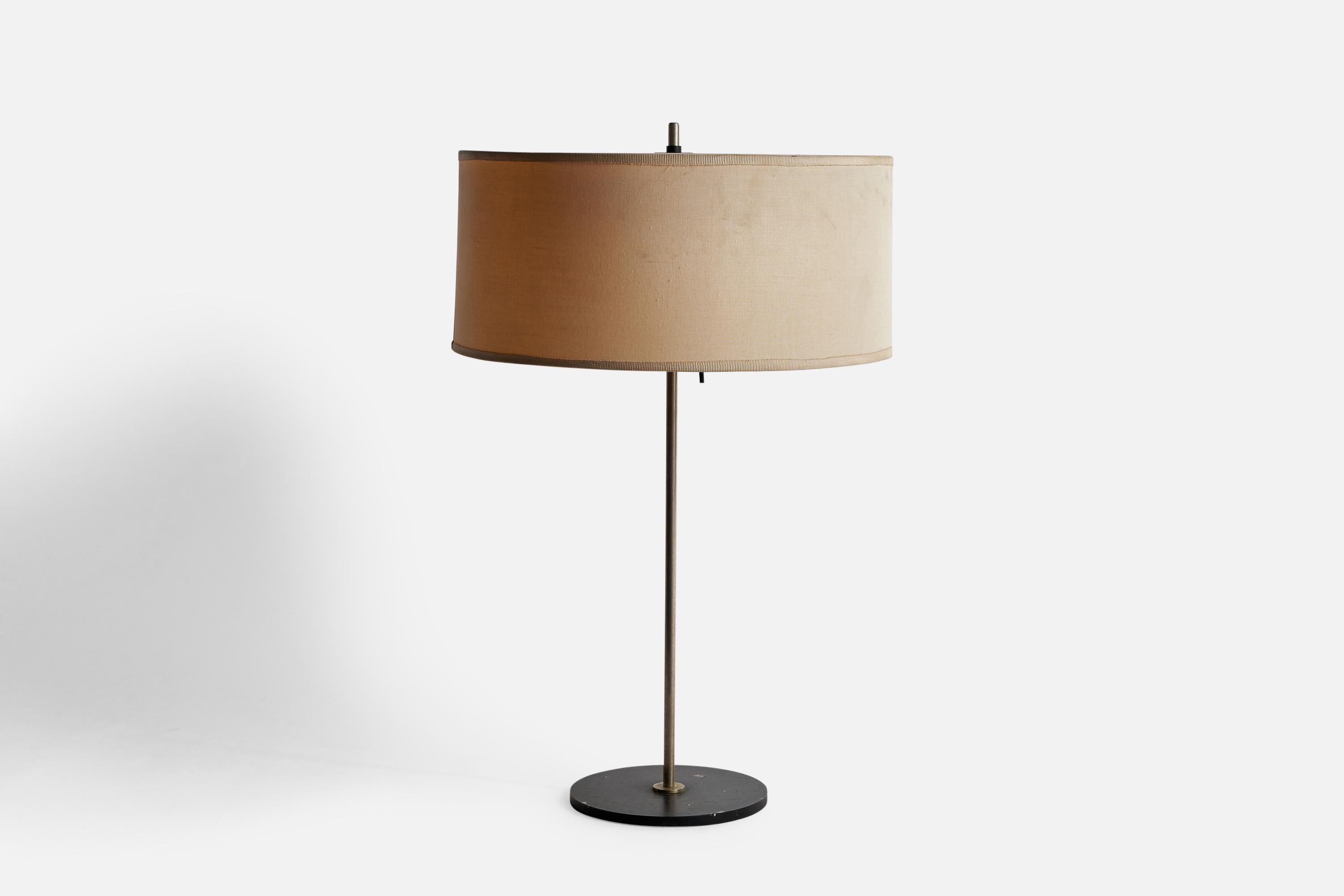 An adjustable steel, black-lacquered metal and off-white fabric table lamp attributed to Angelo Ostuni, Italy, c. 1960s.

Overall Dimensions (inches): 20.75” H x 13” Diameter
Shade height is adjustable
Bulb Specifications: E-26 Bulbs
Number of