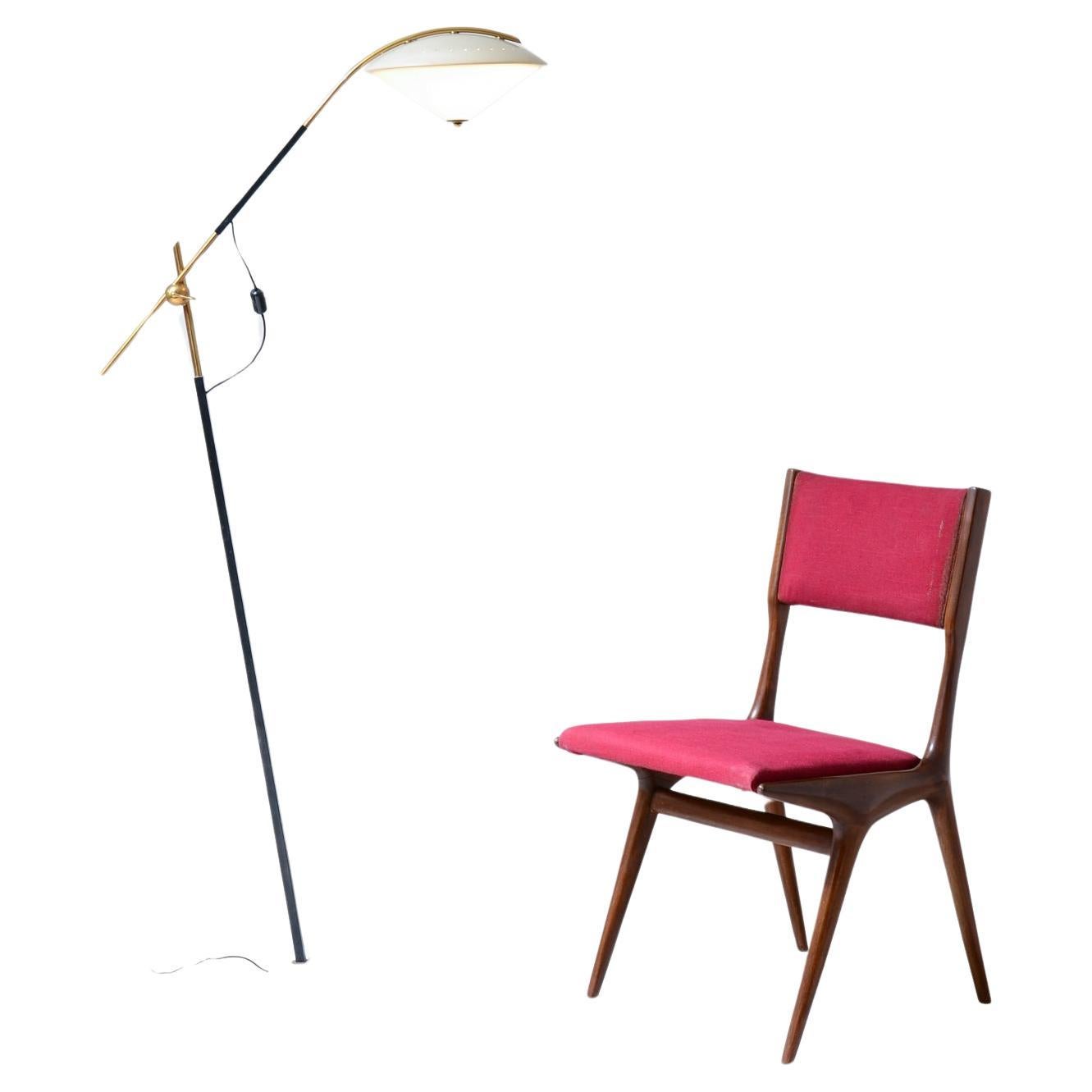 Angelo Ostuni  Elegant floor lamp with adjustable arm For Sale