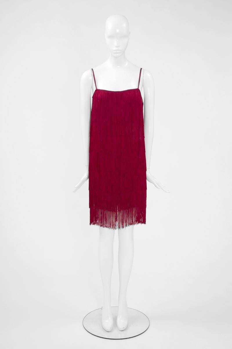 In the mood of the 20's, this late 80's - early 90's Angelo Tarlazzi dress is a playful, statement-making option for any party event ! Cut from vivid fuchsia silk jersey, it is covered in tiers of swishy fringes which are beautifully moving with