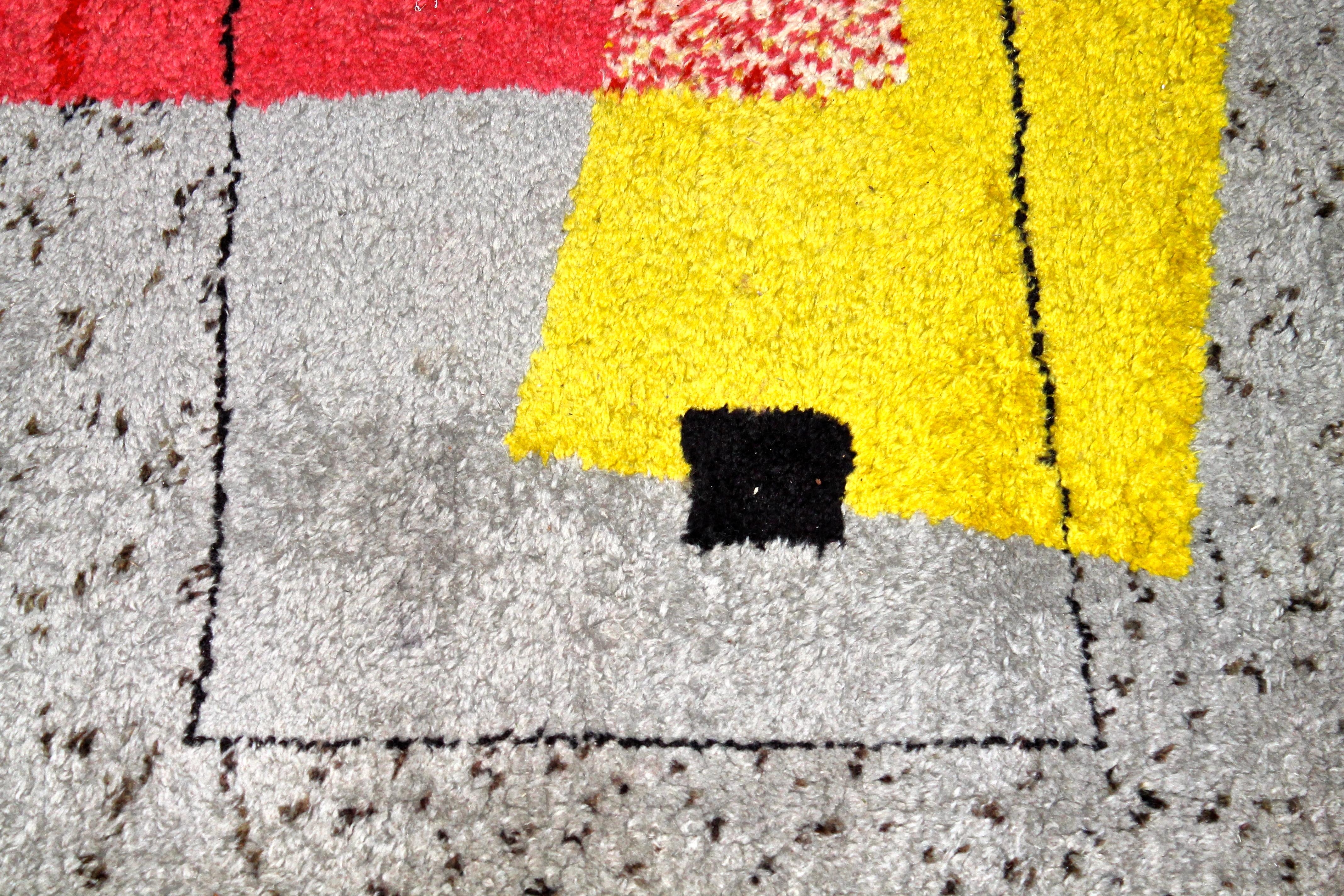 Fabulous and important. This rug by Chicago Fabric designer Angelo Testa (the first graduate of Moholy Nagy's continuation of The Bauhaus in the US: The Institute of Design) is atypical of Testa's work, but more typical of the 