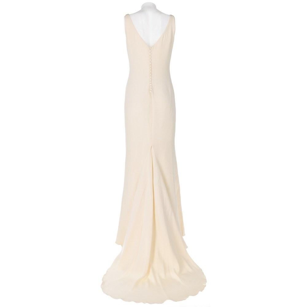 Ivory silk tailored 90s sleeveless mermaid wedding dress with narrow waist. Back zip and covered buttons fastening.

Size: 42 IT

Flat measurements
Height: 170 cm
Bust: 43 cm
Waist: 37 cm
Hips: 46 cm

Product code: X5306

Notes: The item shows a
