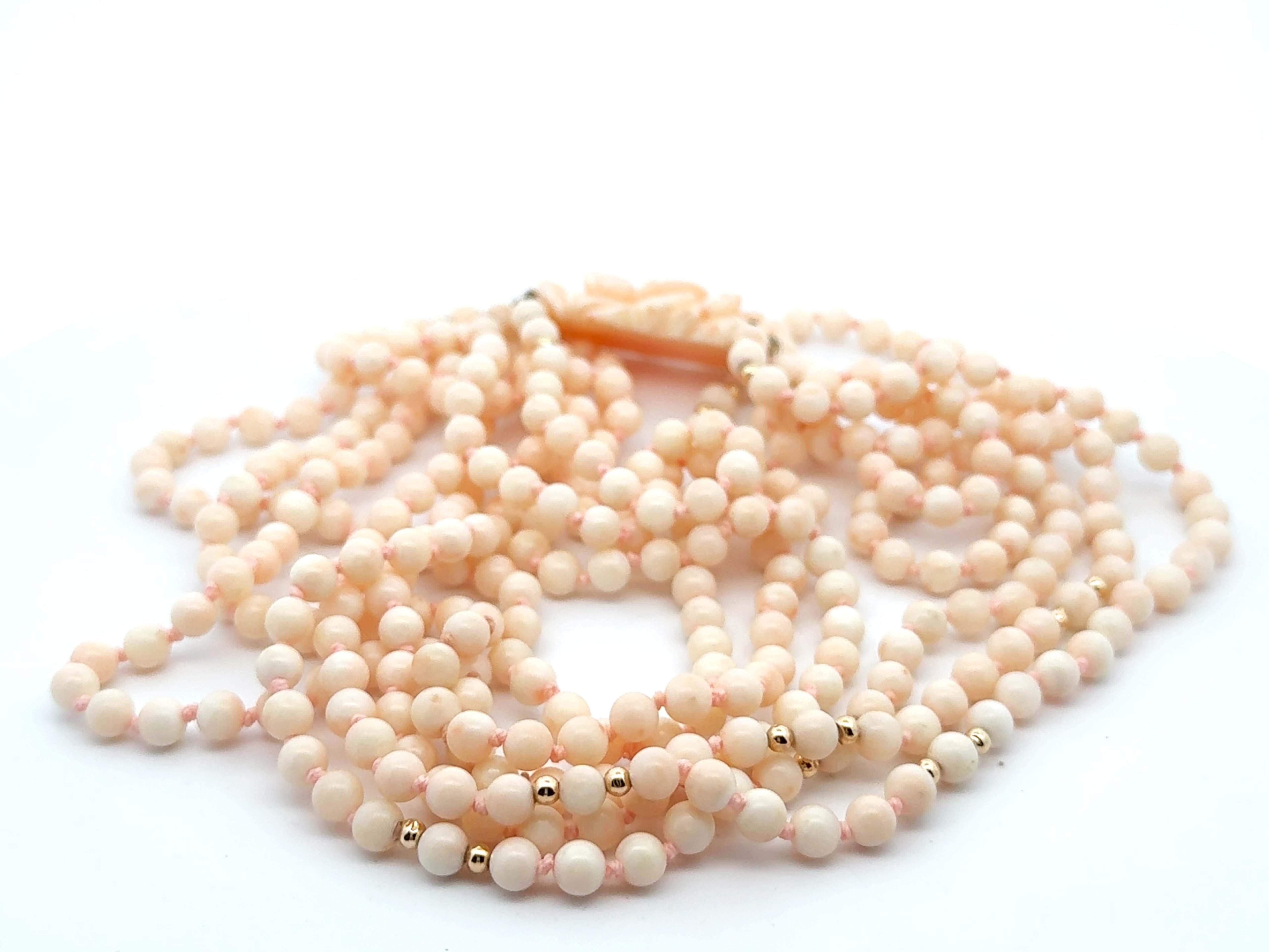 Modern Angelskin Coral Triple Stranded Beaded Necklace 14k Yellow Gold Flower Clasp For Sale