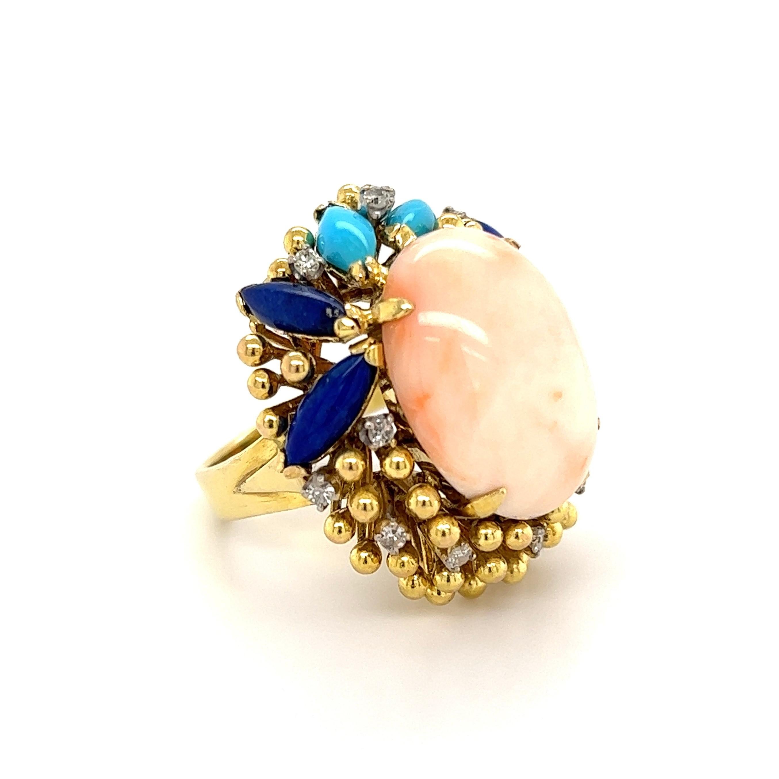 Simply Beautiful!  Finely detailed Angelskin Coral, Lapis Lazuli, Turquoise and Diamond Cocktail Ring. Centering a Hand set 10 Carat Angelskin Coral, surrounded by Lapis, Turquoise and 12 Diamonds, approx. 0.36tcw. Hand crafted 14K Yellow Gold