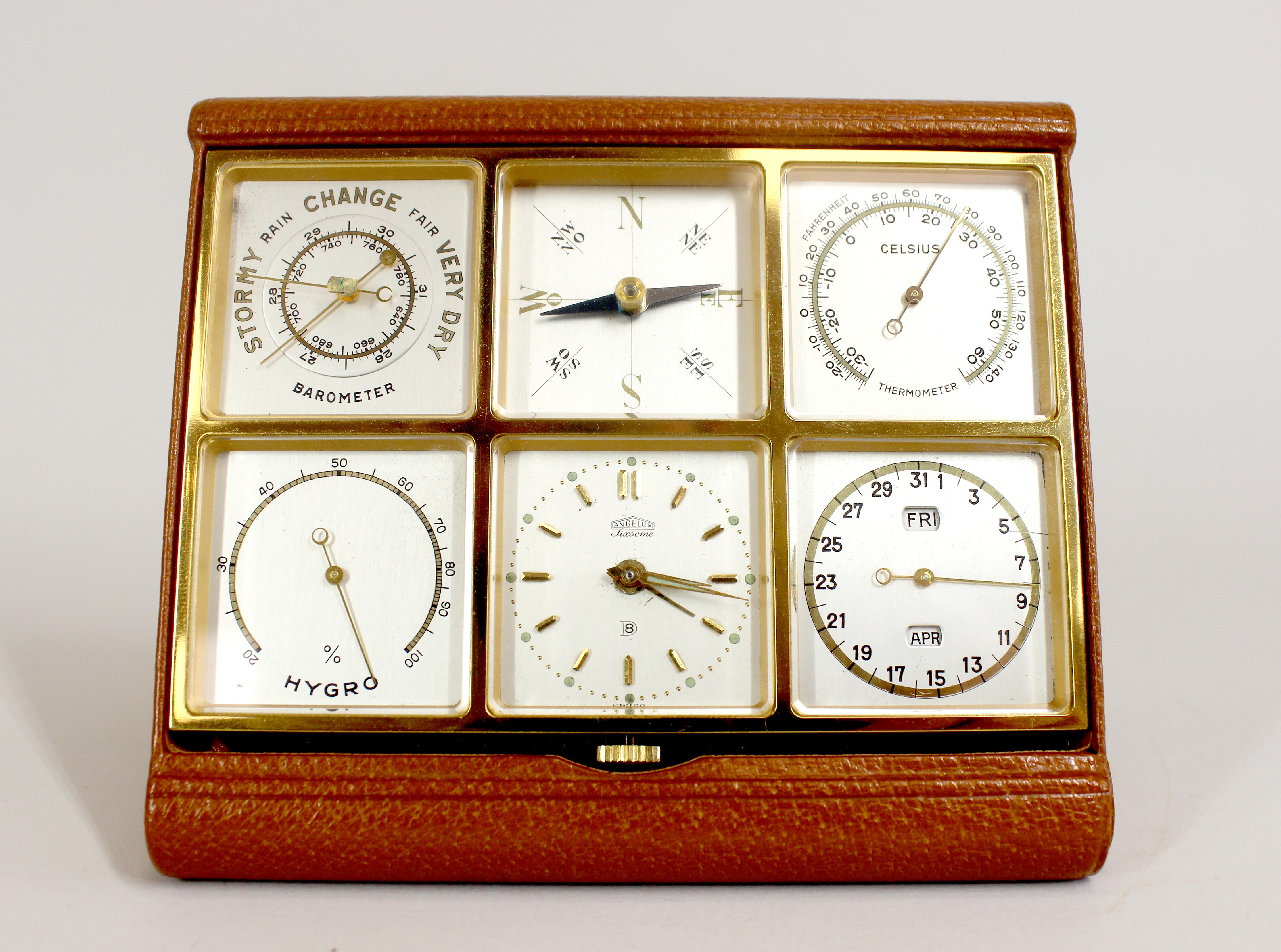 An extremely rare Angelus Sixsome eight day travelling alarm clock and desk compendium. Containing an eight day running alarm clock, with full Calendar, Barometer, Hygrometer, thermometer and compass. Housed in a an immaculate gilded panel, all
