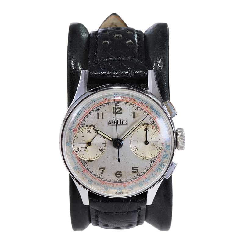 FACTORY / HOUSE: Angelus Watch Company
STYLE / REFERENCE: Round / Rectangle Button Chronograph
METAL / MATERIAL: Stainless Steel
DIMENSIONS: Length 42mm  X Diameter 35mm
CIRCA: 1940's 
MOVEMENT / CALIBER: Manual Winding / 17 Jewels / Cal. Valjoux