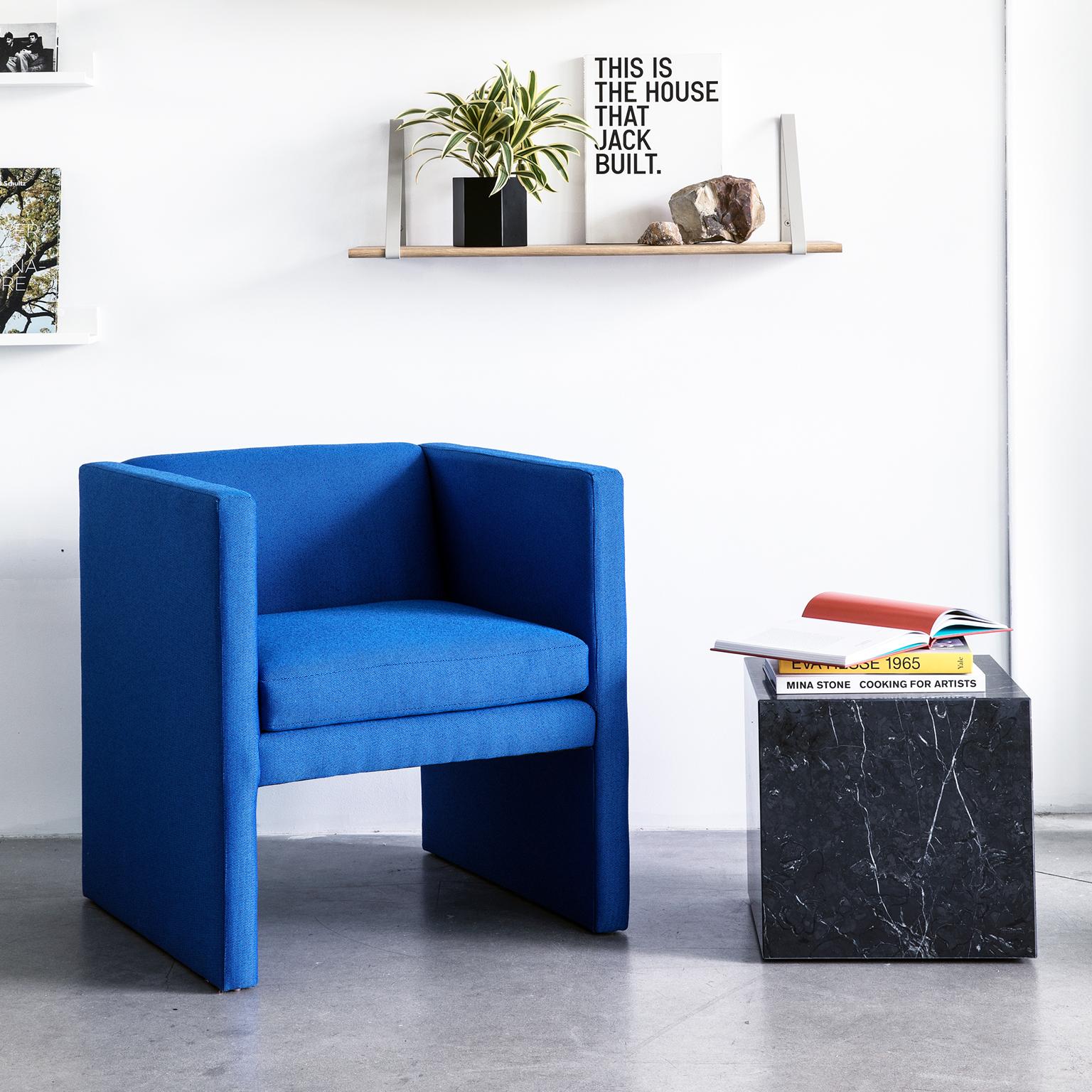 The Angle chair is a simple, sculptural statement piece. Designed in-house by TRNK, we sought out to create a chair that is comfortable, statement-making and small-space friendly by maintaining a very lean footprint. Pictured above in Ultramarine,