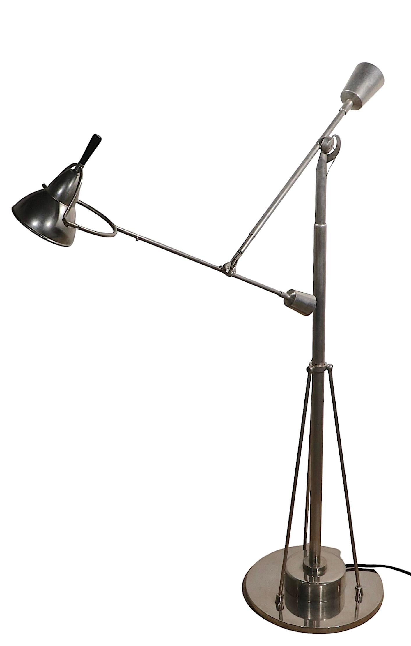 Well crafted replica of the iconic angle poise lamp originally designed in France in t the 1920's by Edouard - Wilfred Buquet, this is a high quality later reproduction. The lamp features two articulating joints which allow positioning of the light,