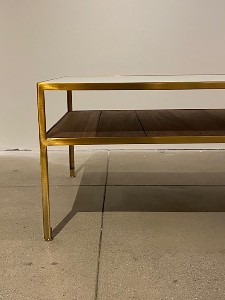 Regeneration angle steel coffee table with powder coated brass frame, walnut slats and white back painted glass top. Custom sizes available.