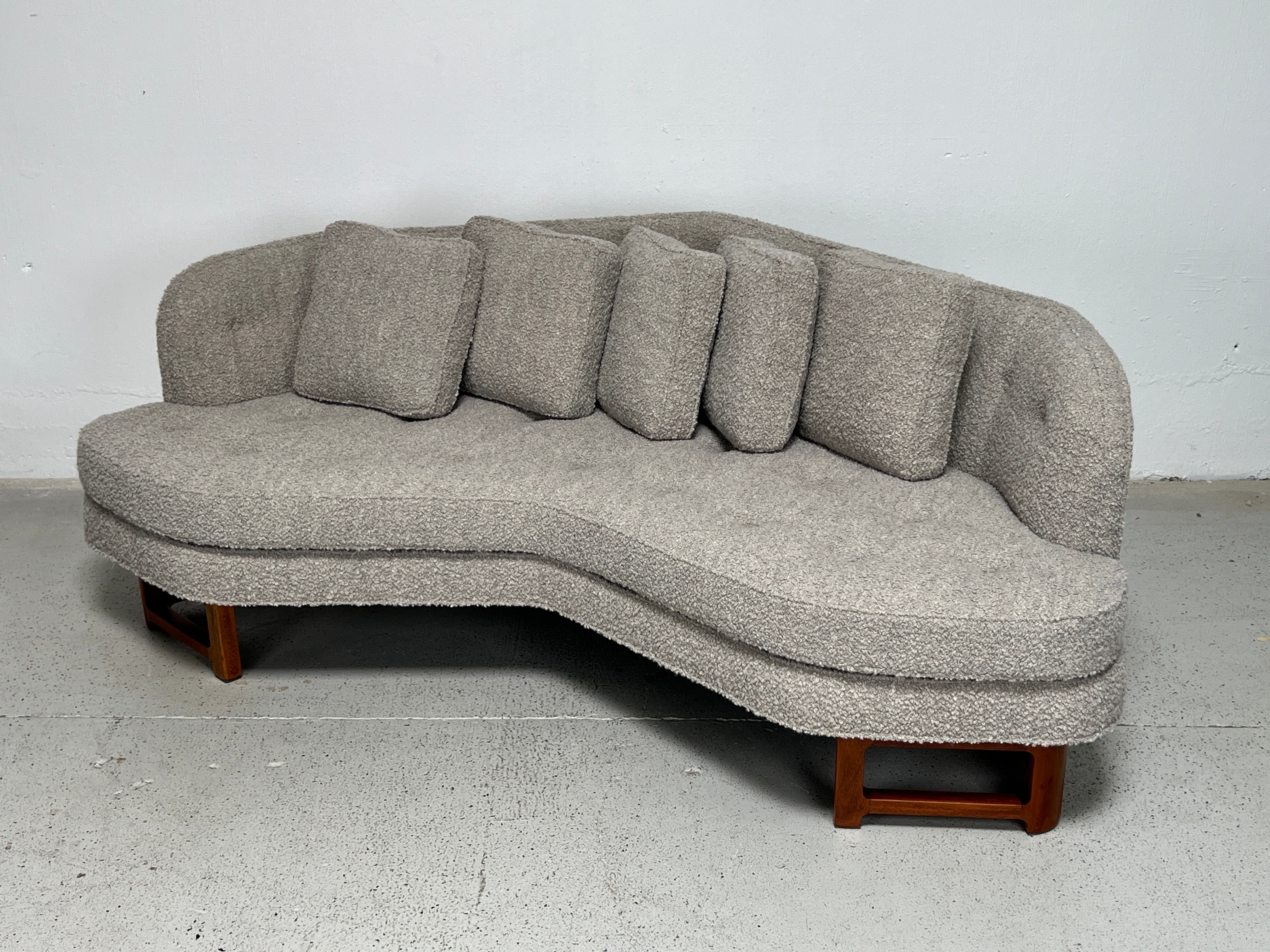  An angled sofa designed by Edward Wormley for Dunbar. Beautifully restored with refinished mahogany base and reupholstered in Holly Hunt / Terazzo / Silver Blue. New down pillows. 