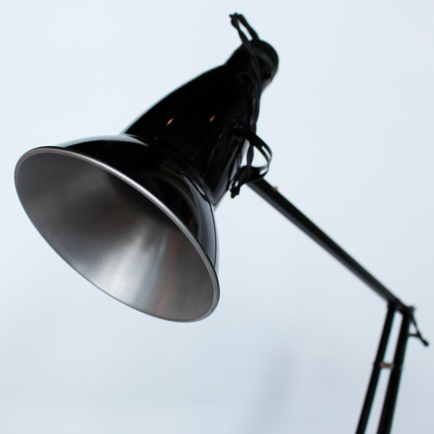 An Art Deco, original angle poise desk lamp with three step base by Herbert Terry & Sons. Designed by George Carwardine. Original stamps to stem.

Fully refurbished, re-wired, stripped, painted black and re-chromed. Some replacement parts.