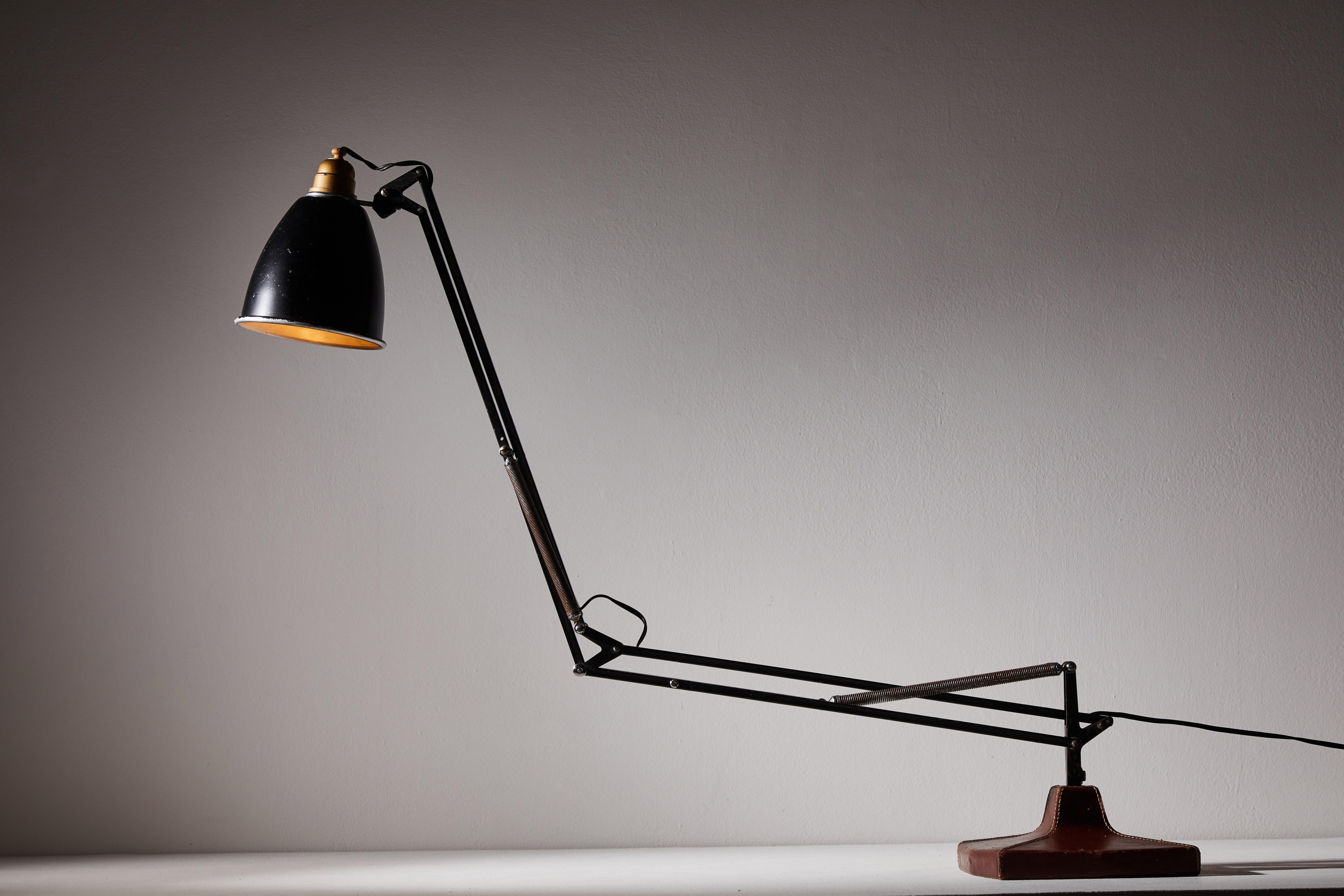 Anglepoise table lamp by George Cawardine & Hermes for Herbert Terry & Sons Ltd. Designed and manufactured in United Kingdom, circa 1930s. Leather over steel, enameled aluminum, enameled brass. Original cord. Signed with impressed gilt