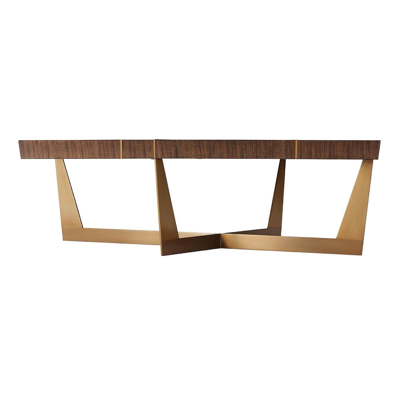 Modern coffee table with an angled edge rectangular slab top, with intersecting brass inlaid relief lines on an angled brass finish steel base.

Dimensions: 52