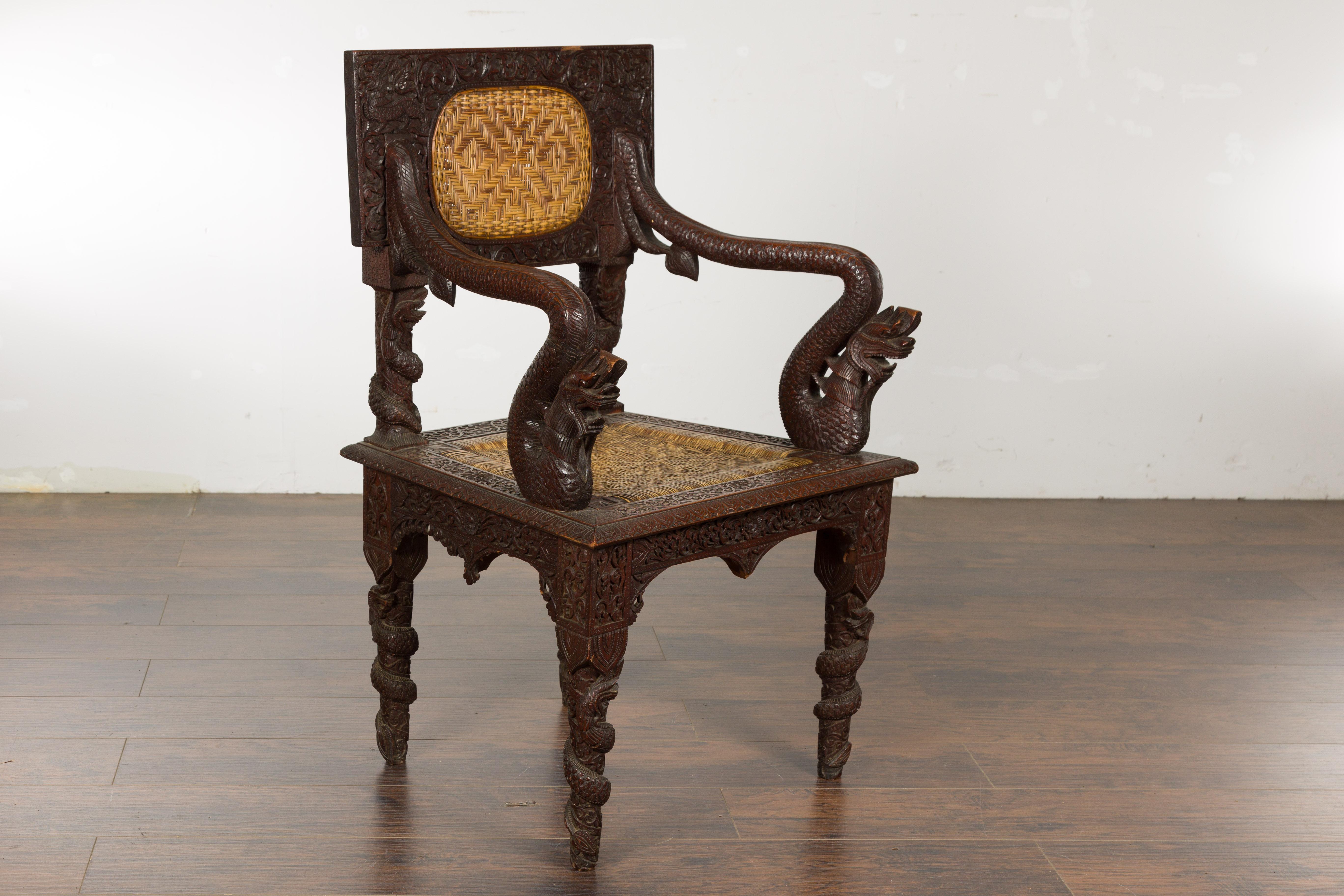 Anglo-Indian 1900 Armchair with Carved Back, Mythical Creatures and Woven Rattan For Sale 5