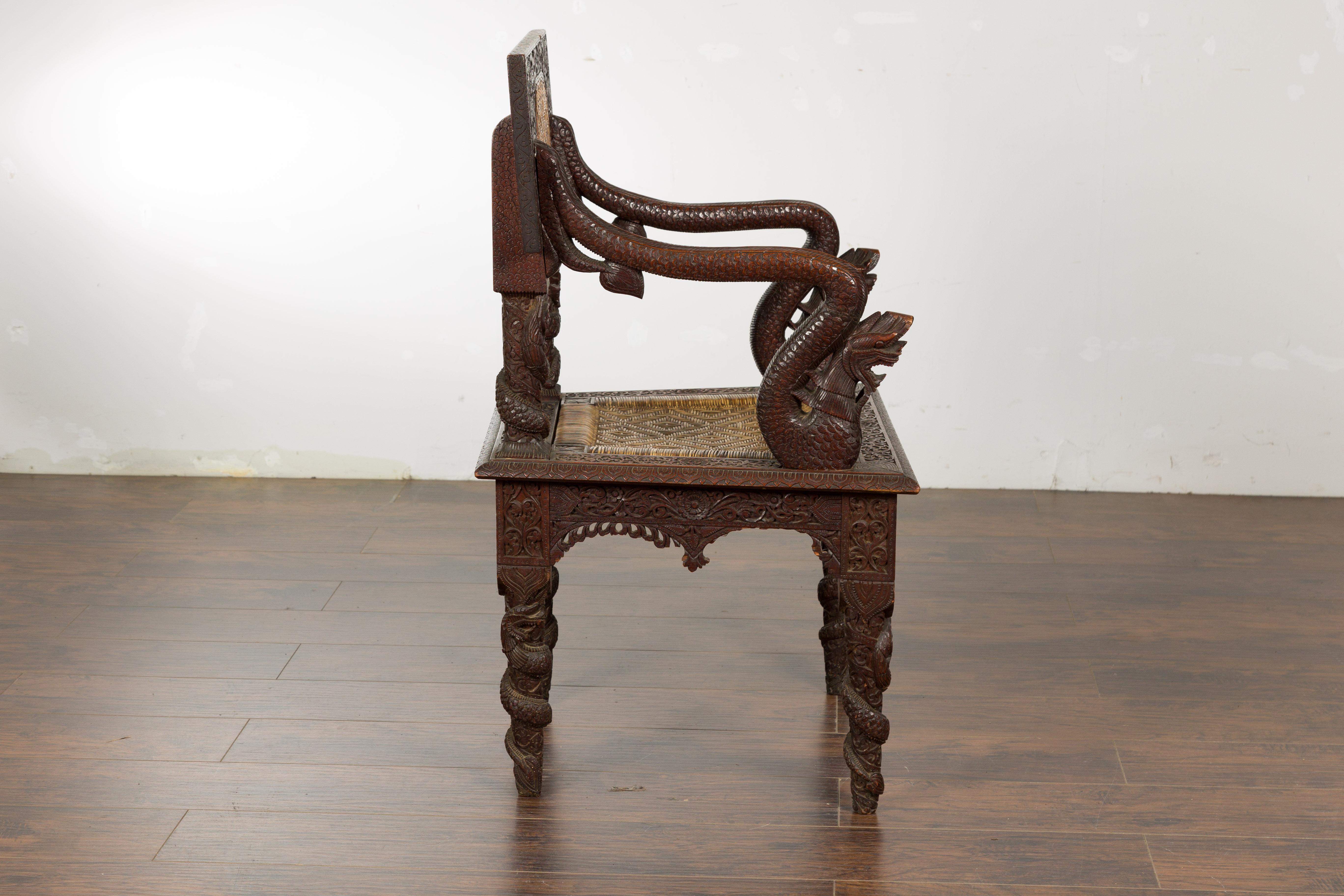 Anglo-Indian 1900 Armchair with Carved Back, Mythical Creatures and Woven Rattan For Sale 8