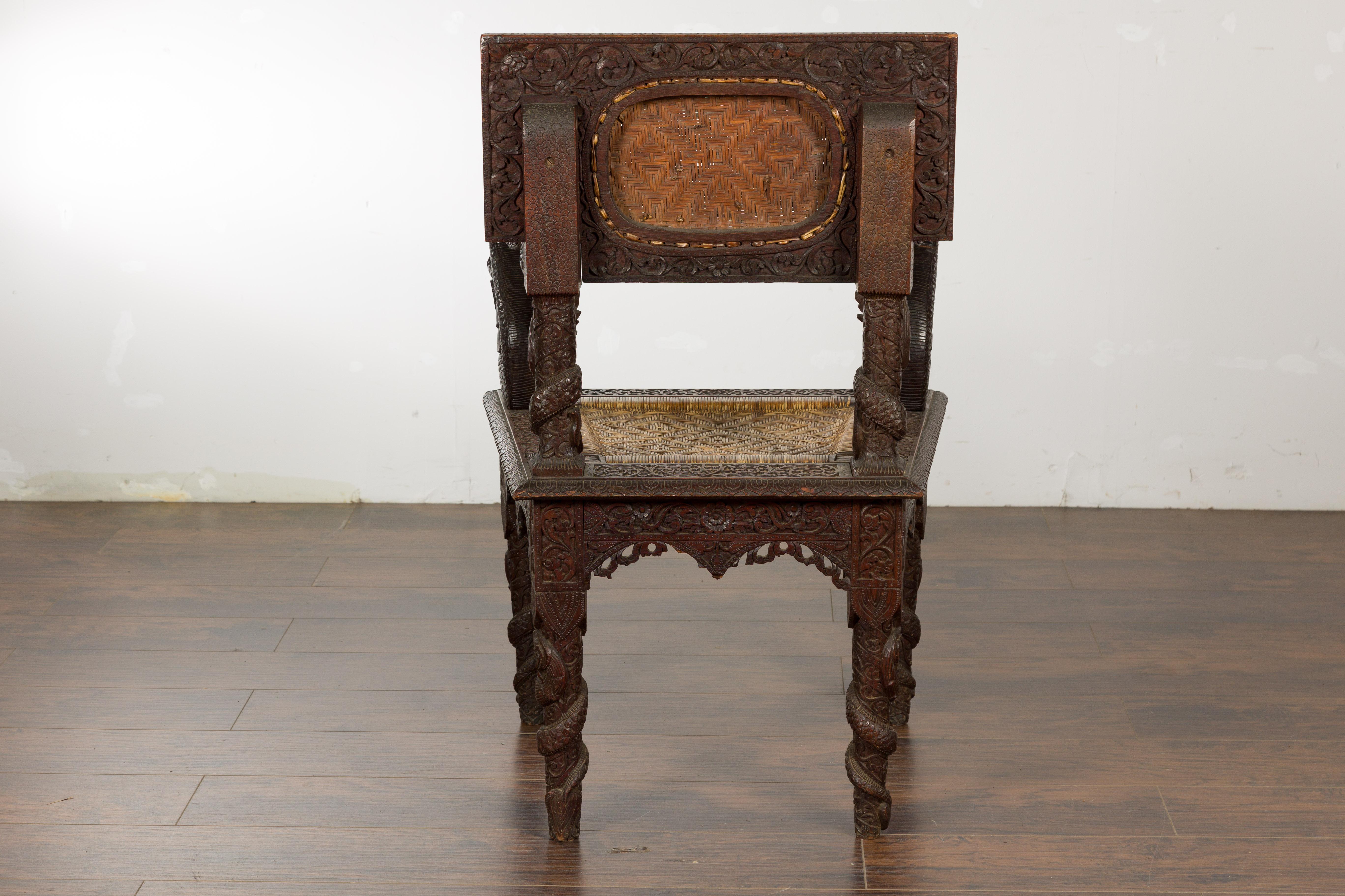 Anglo-Indian 1900 Armchair with Carved Back, Mythical Creatures and Woven Rattan For Sale 9